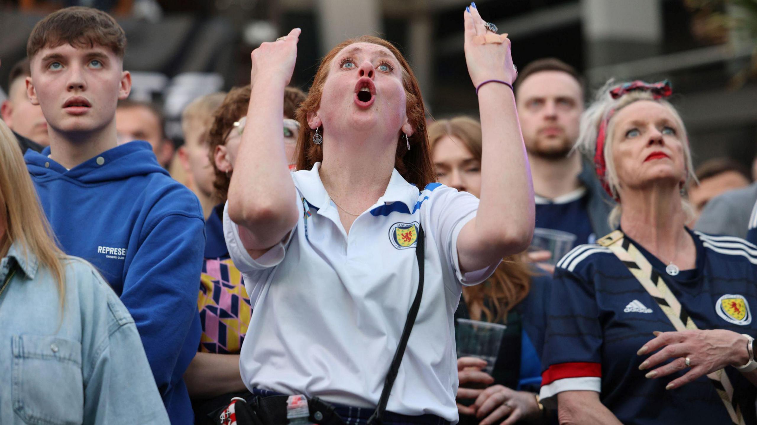 Scotland fans react during their defeat to Germany