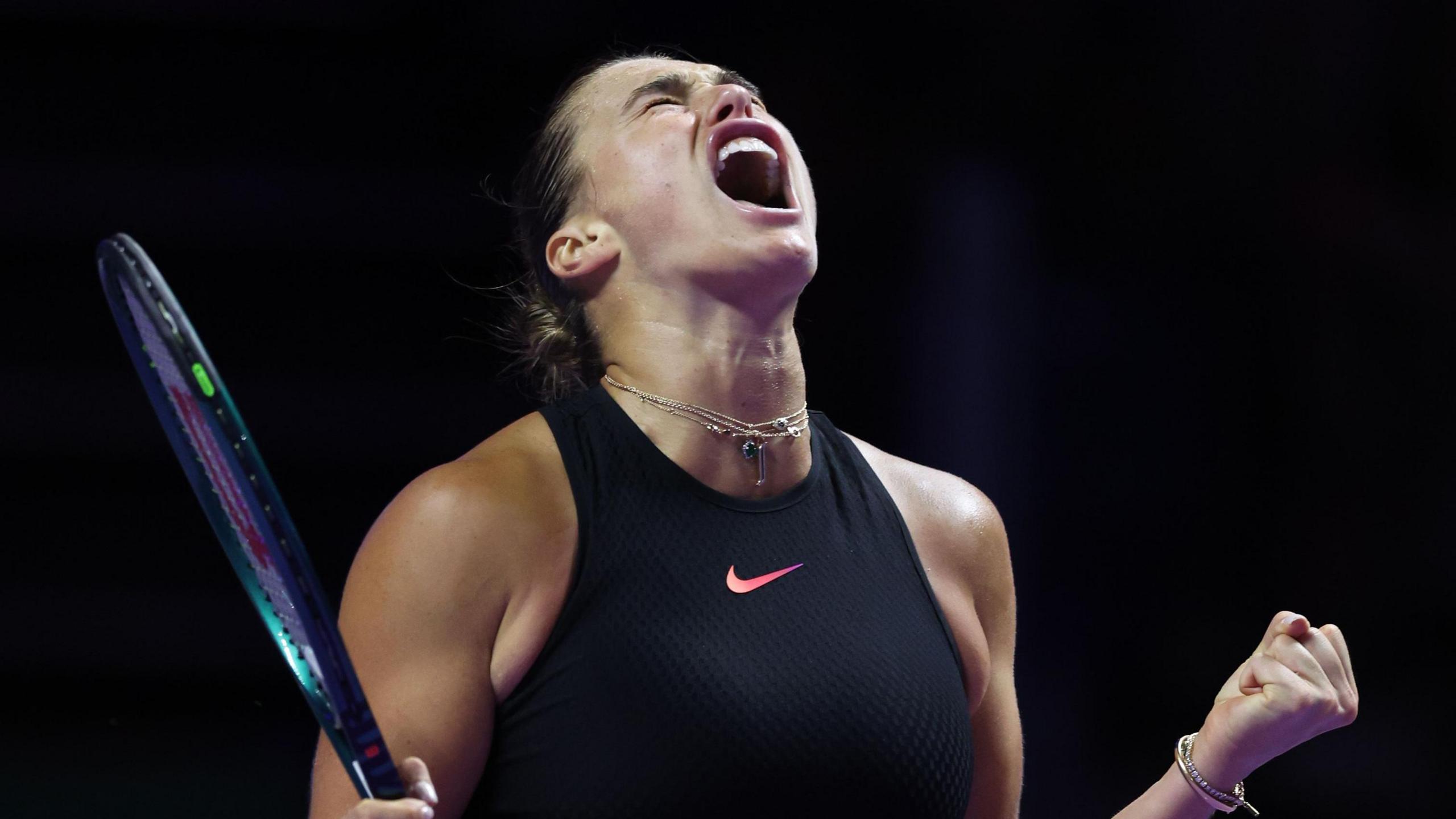 Aryna Sabalenka celebrates victory over Jasmine Paolini