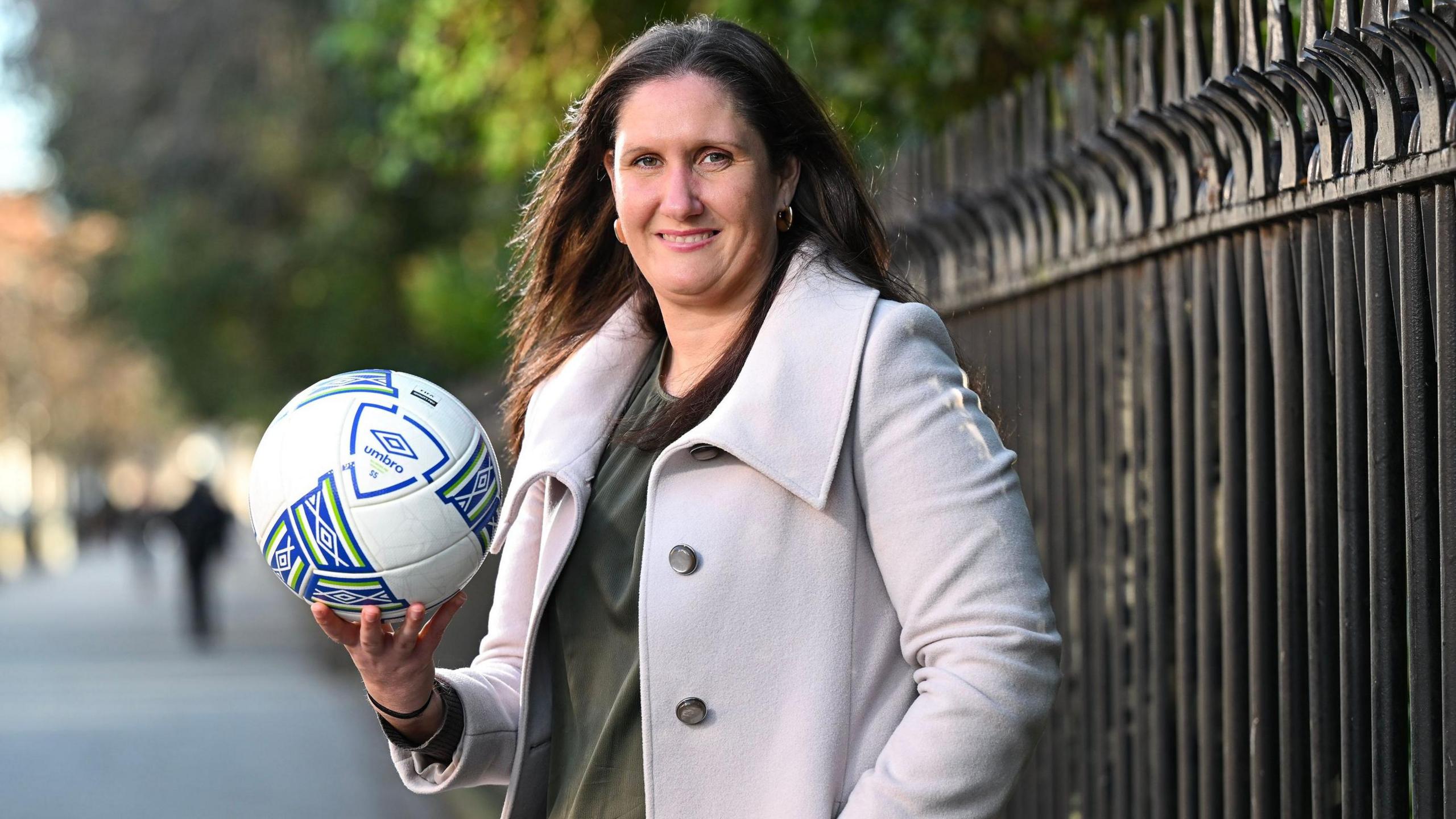 Hannah Dingley poses with a football 