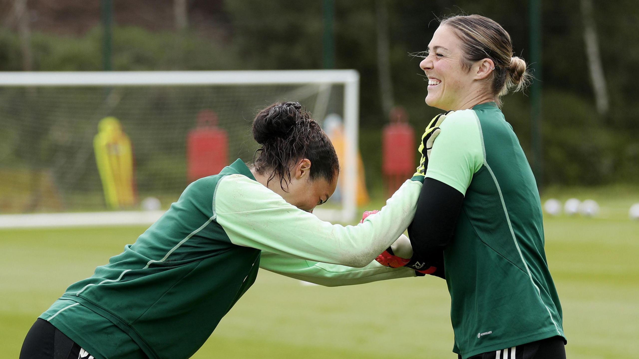 Phallon Tullis-Joyce and Mary Earps warm up