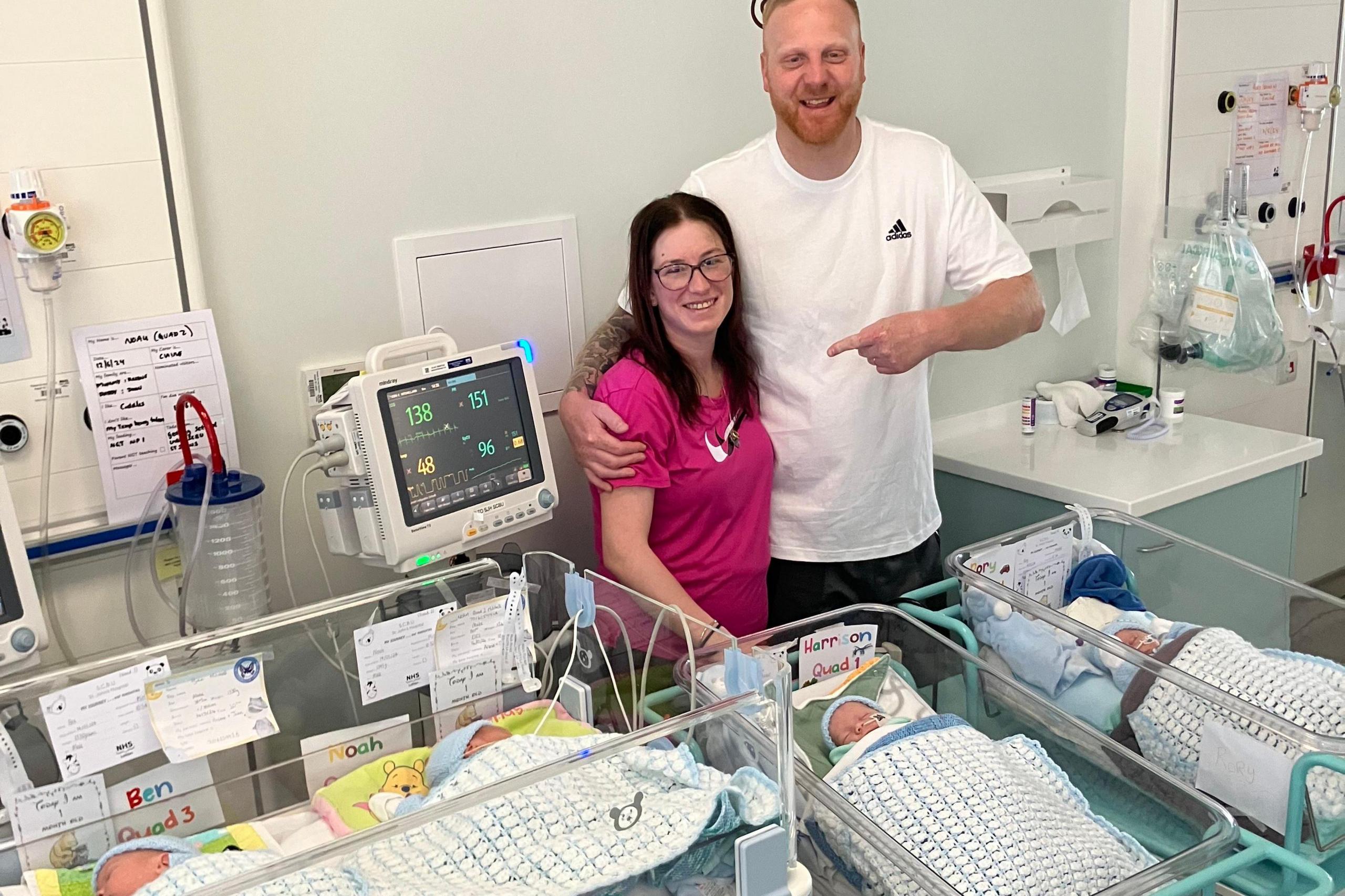 Arlene and John Mitchell with the quadruplets