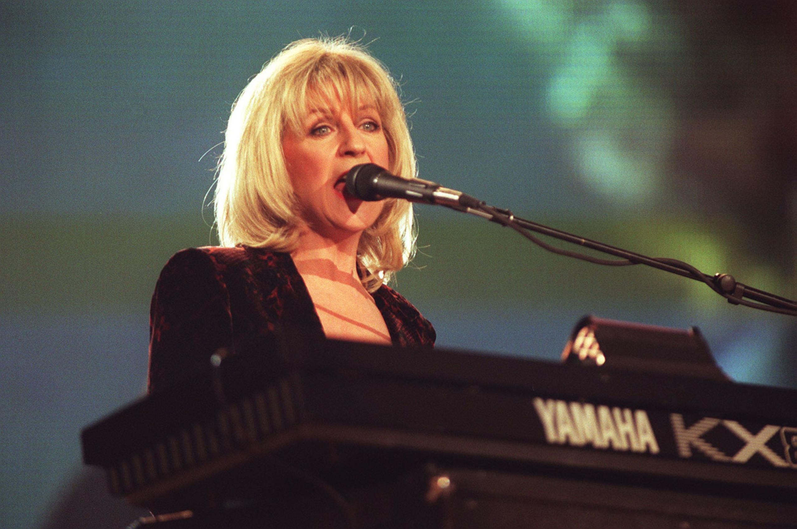 A File photo dated 09/02/98 of Fleetwood Mac's, Christine McVie, performing at the Brit Awards at the London Docklands Arena. She is sat behind a keyboard and is singing. She has blond hair in a bob and a fringe.