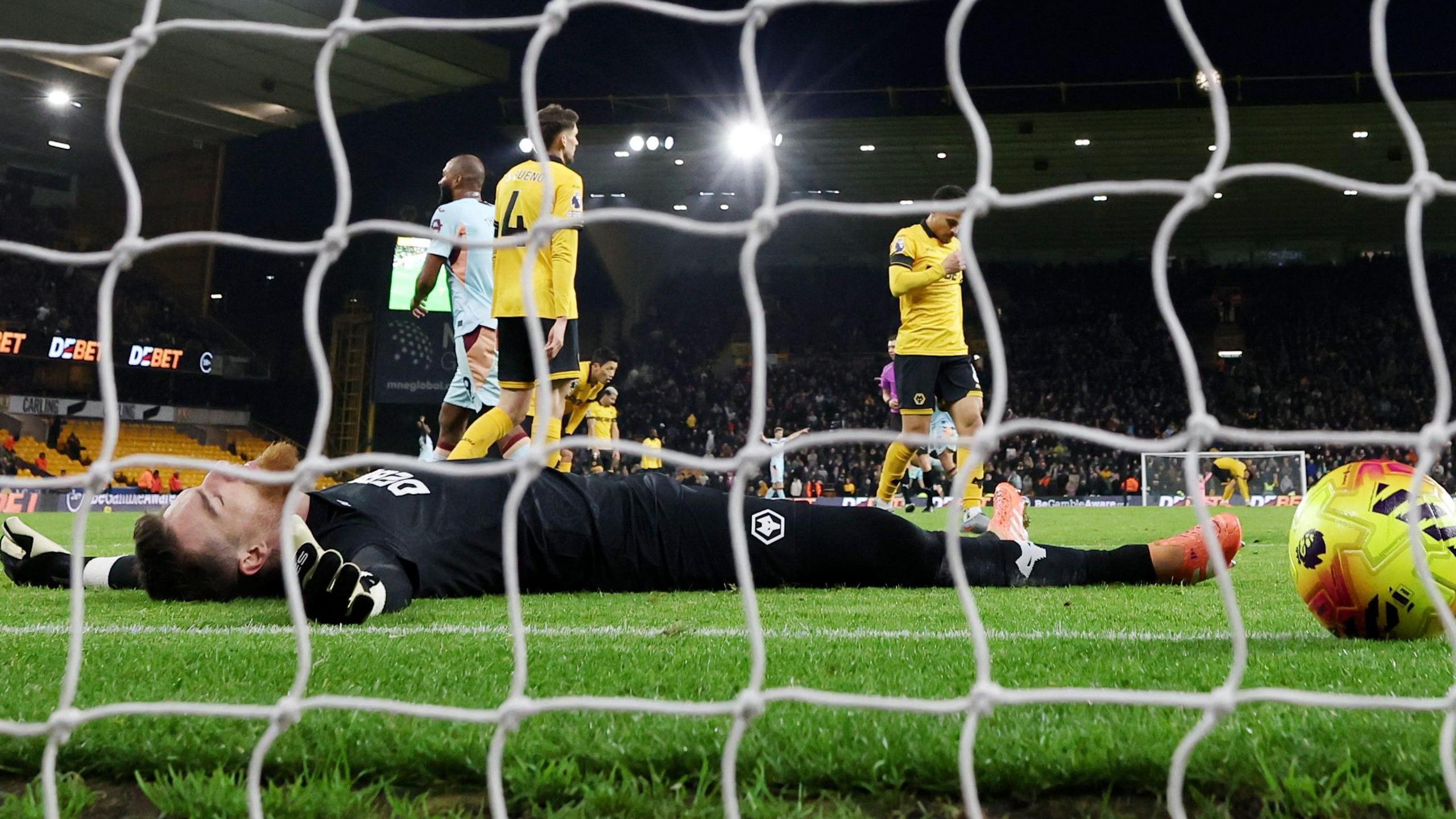 Jose Sa lies on his back after conceding