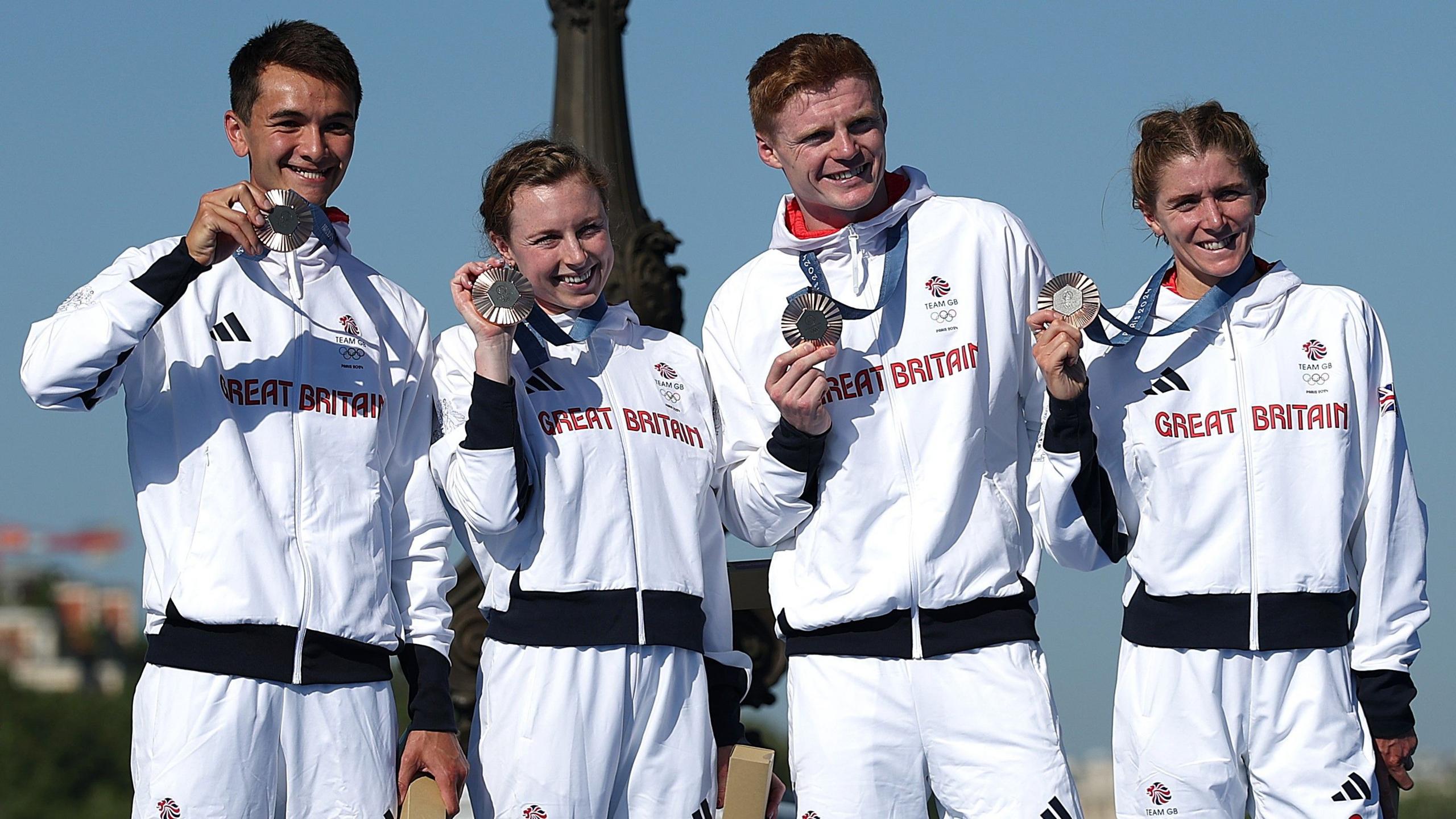 Great Britain's Alex Yee, Georgia Taylor-Brown, Samuel Dickinson and Beth Potter with their bronze medals