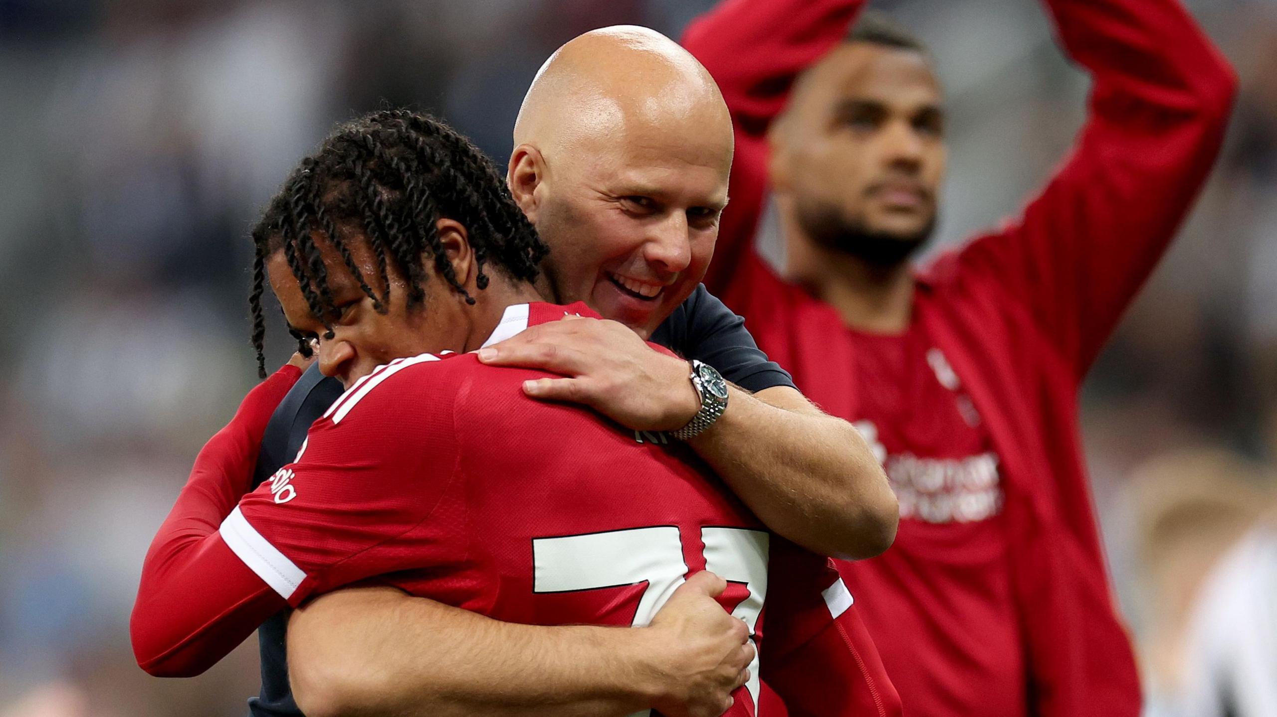 Liverpool head coach Arne Slot celebrates with 16-year-old Rio Ngumoha who became the youngest scorer in the club's history with the winner at Newcastle