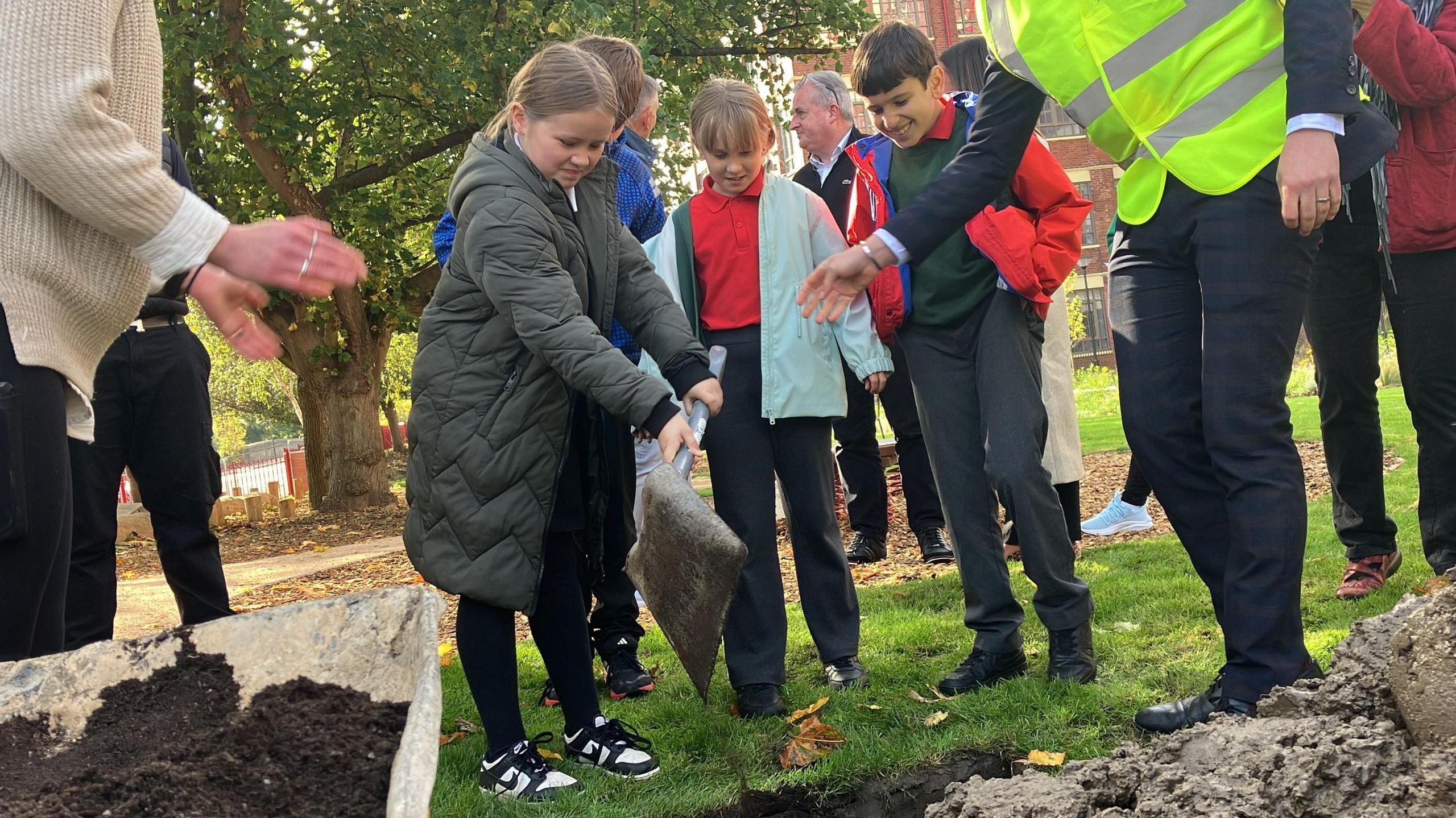 Children burying time capsule