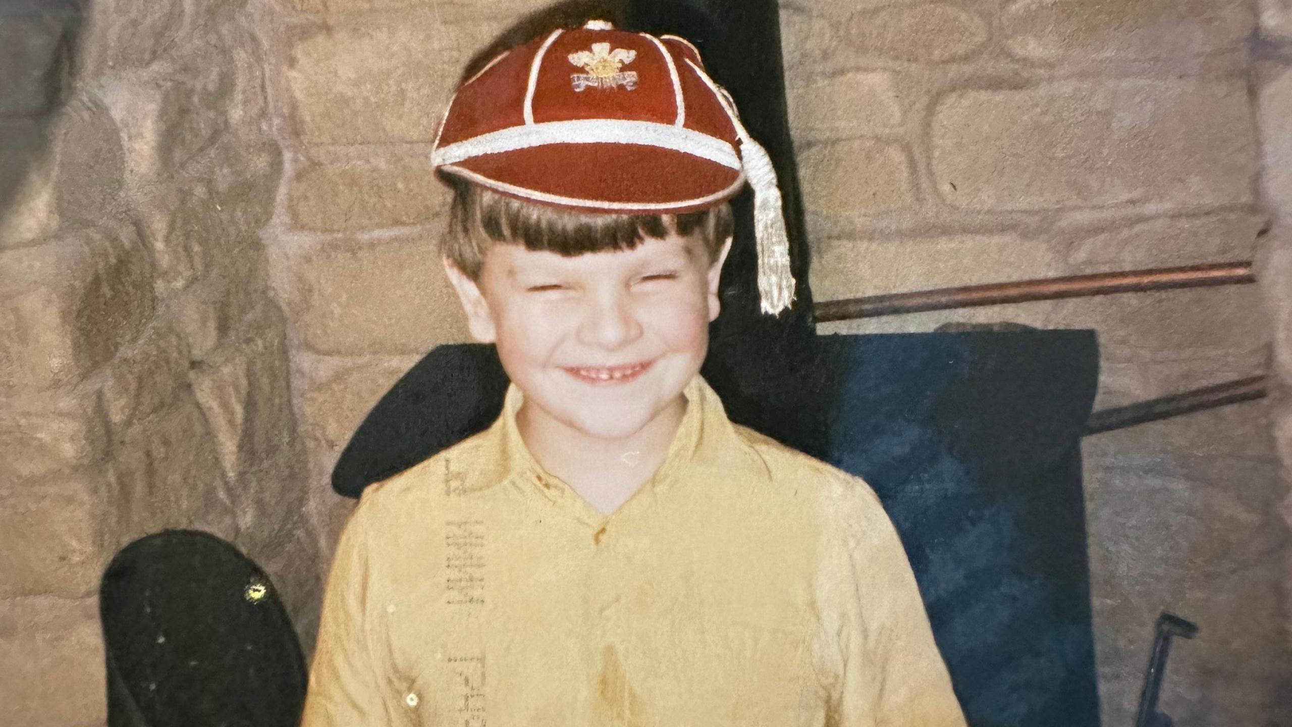 Conor pictured as a young boy wearing his father's Welsh rugby cap. 