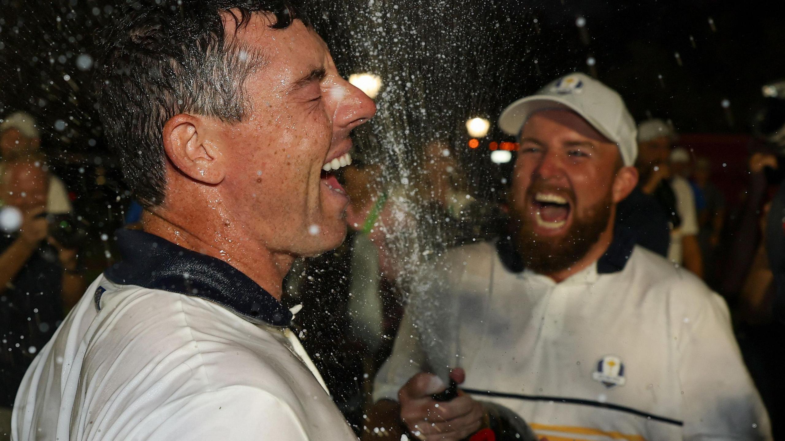 Shane Lowry spraying Rory McIlroy with champagne at Bethpage after their Ryder Cup victory