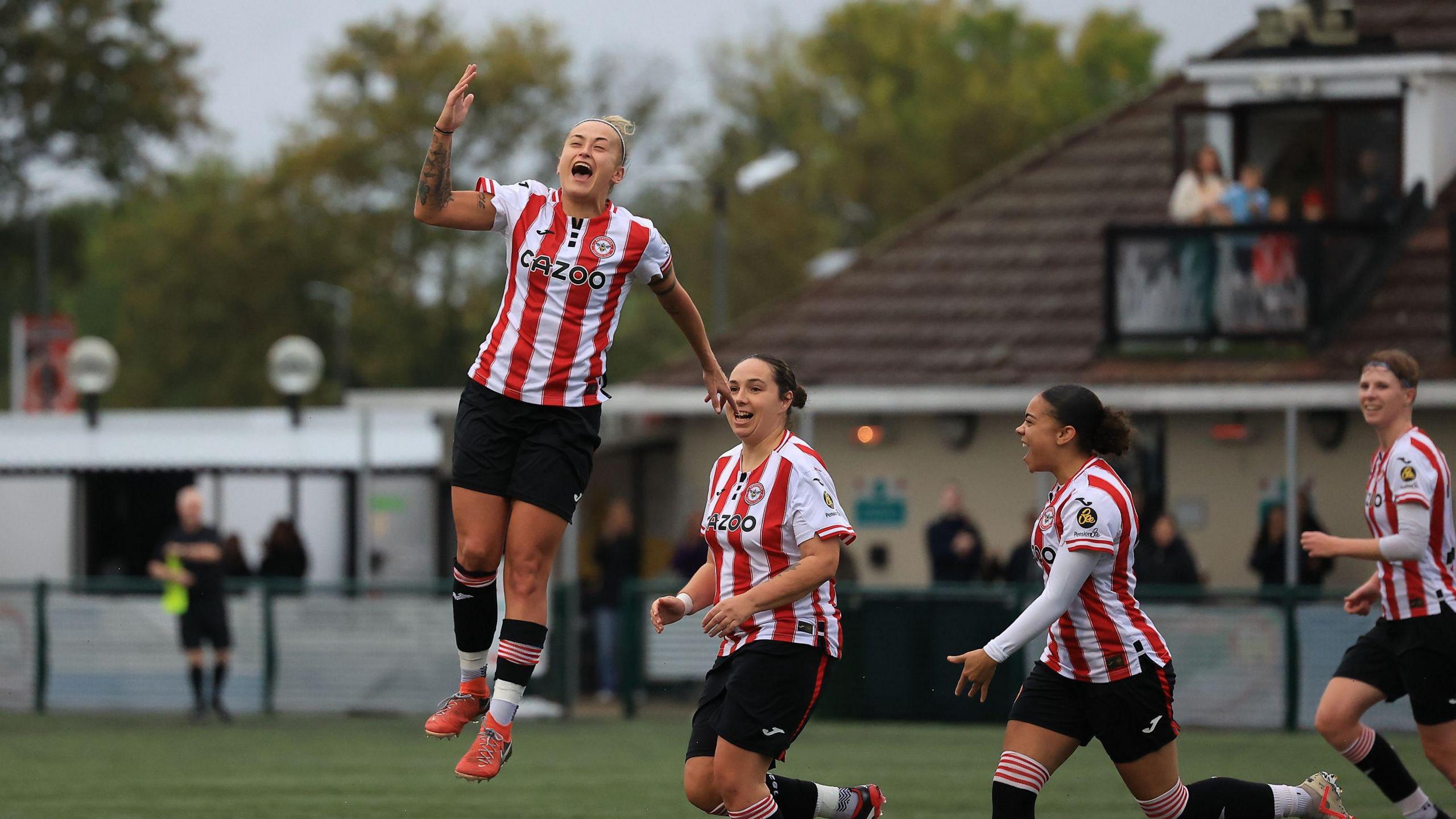 Ashley Cheatley celebrates scoring with her teammtes
