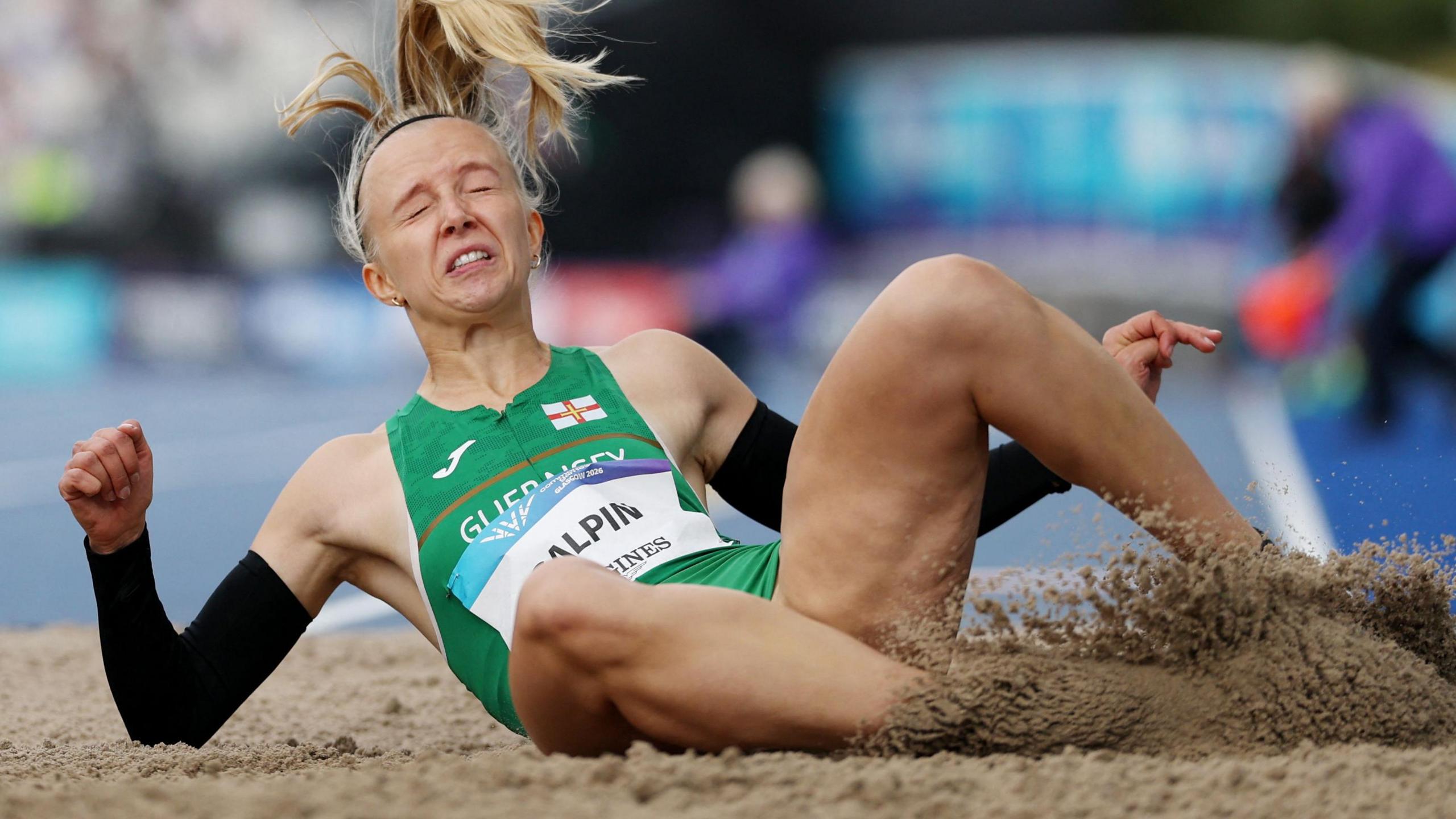 Abi Galpin lands in the long jump pit