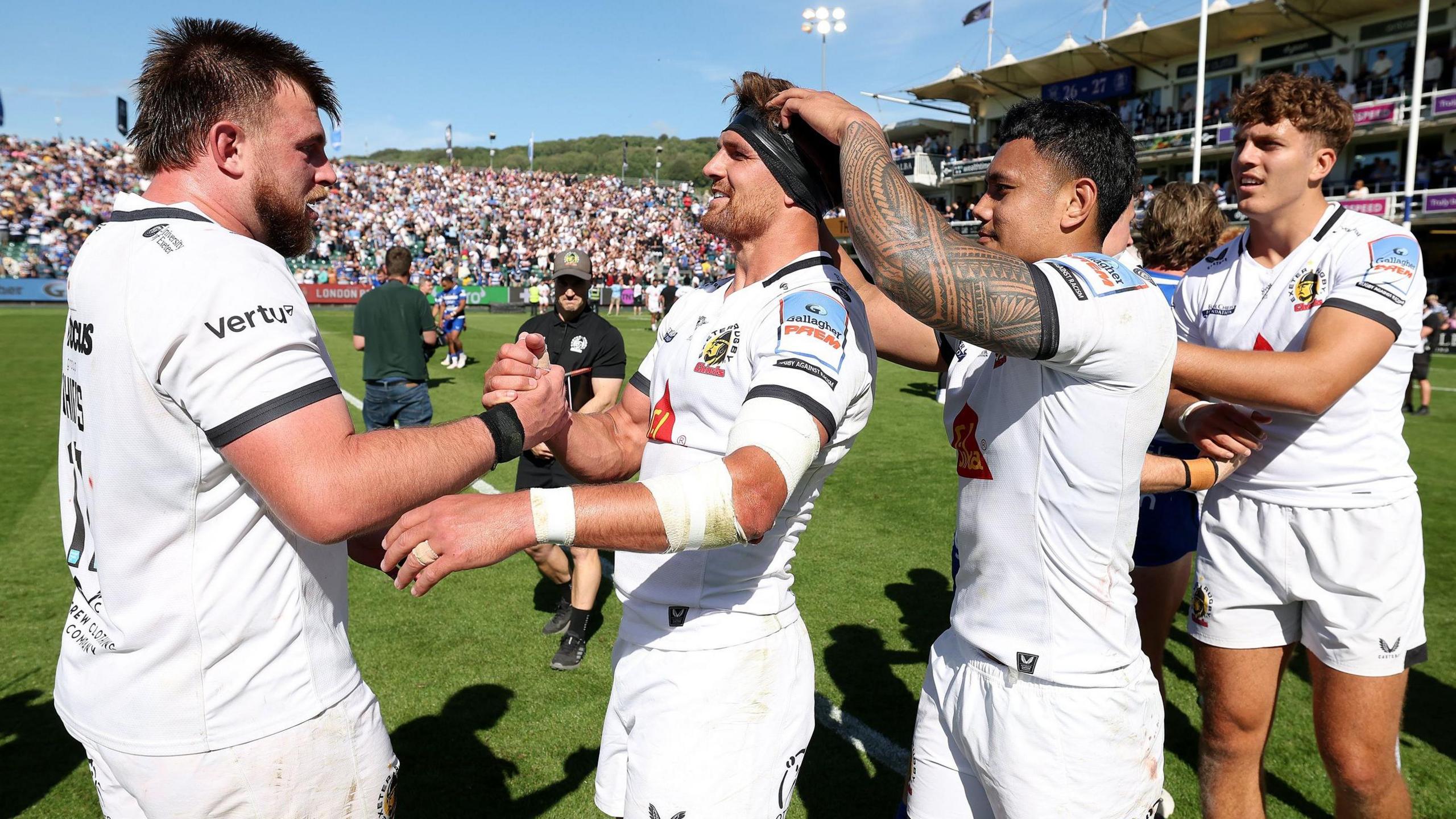 Exeter players celebrate winning at Bath