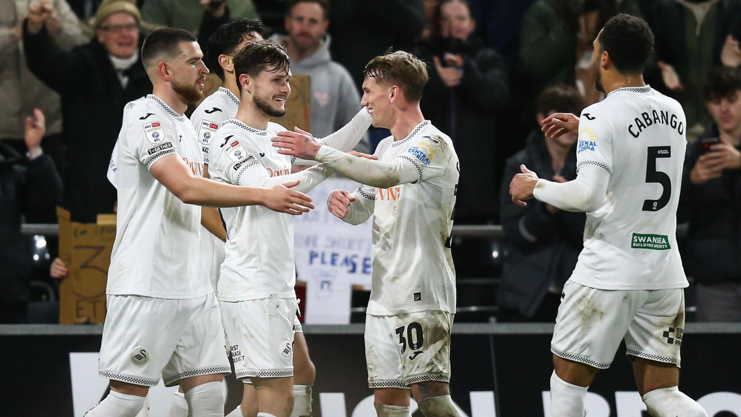 Liam Cullen celebrates his winner in Swansea's recent home game against Portsmouth with team-mates 