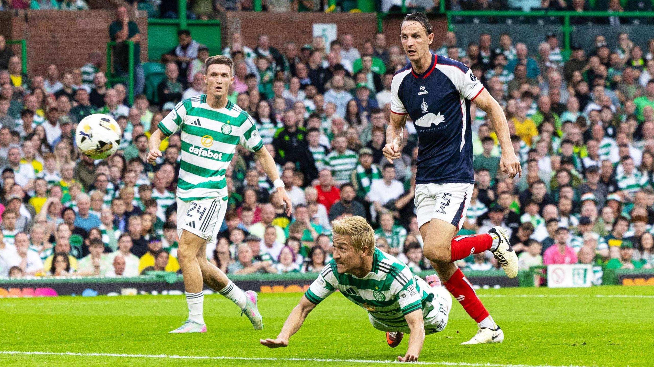 Celtic's Daizen Maeda heads home against Falkirk