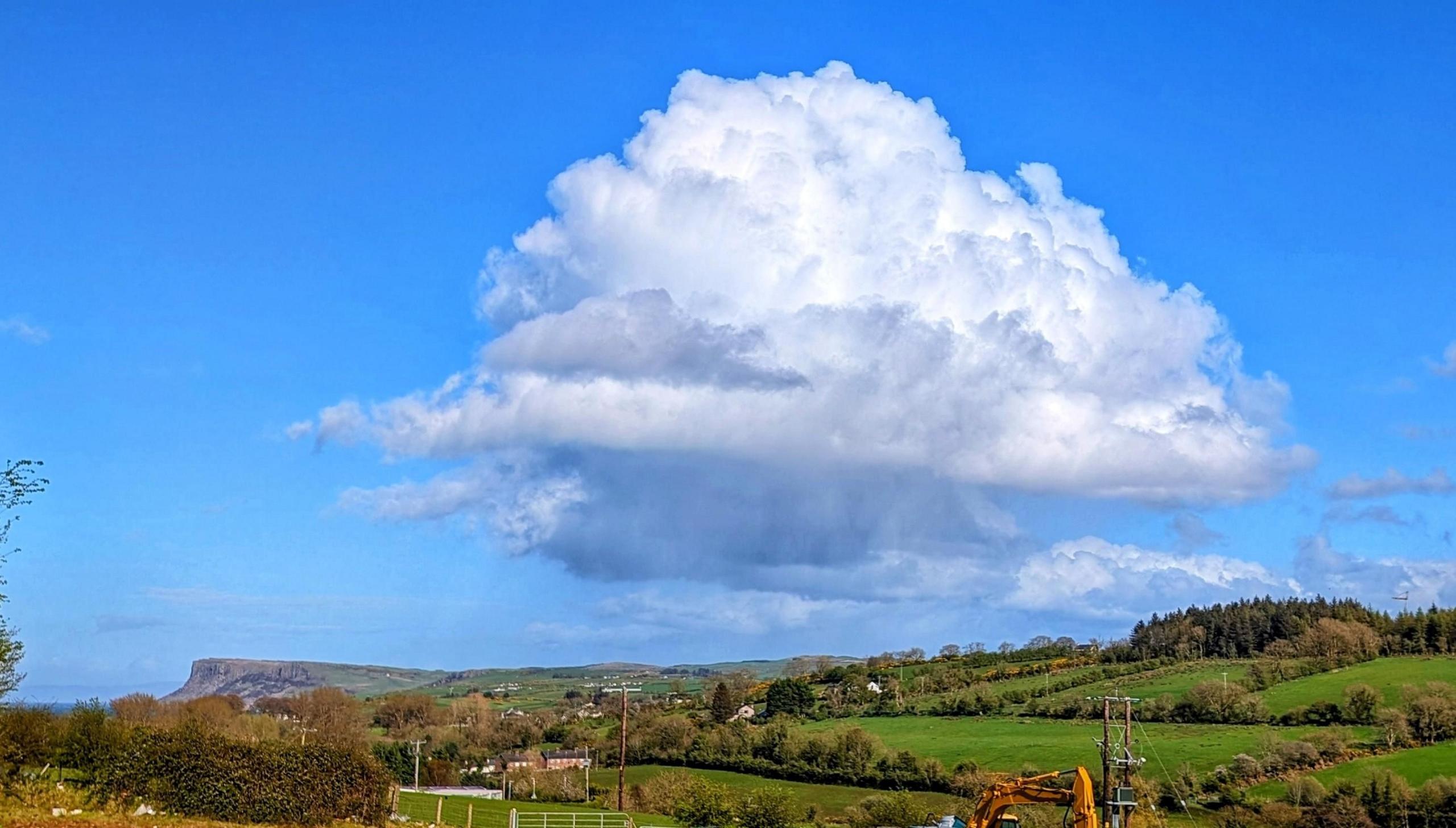 Cumulus cloud above a rural landscape in Ballycastle, County Antrim