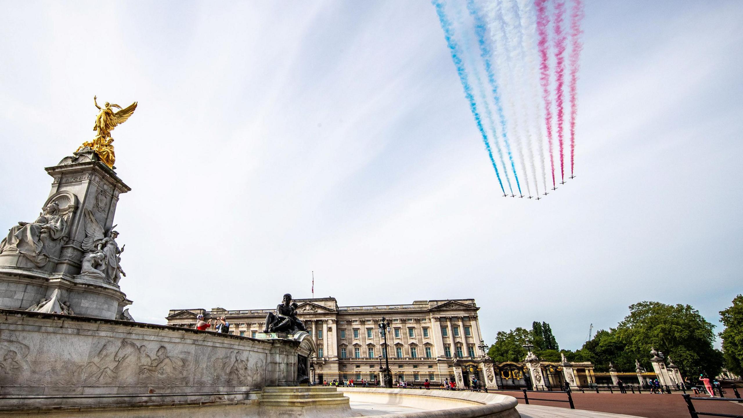 The Red Arrows conduct a flypast over Buckingham Palace as part of the 75th Anniversary of Victory in Europe (VE Day), in London