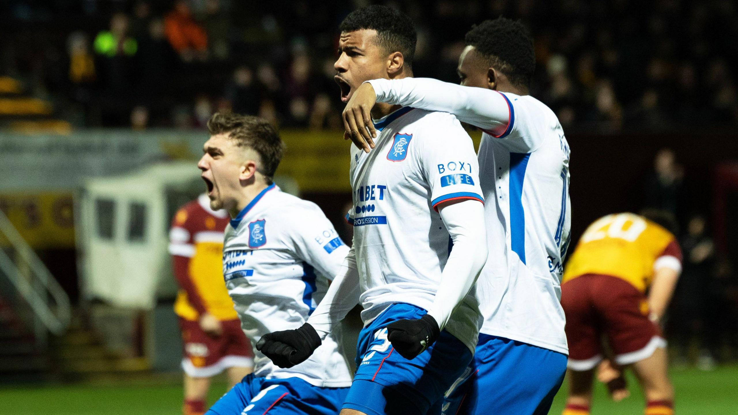 Rangers Hamza Igamane celebrates with Rabbi Matondo and Ridvan Yilmaz after scoring to make it 2-2 during a William Hill Premiership match between Motherwell and Rangers at Fir Park,