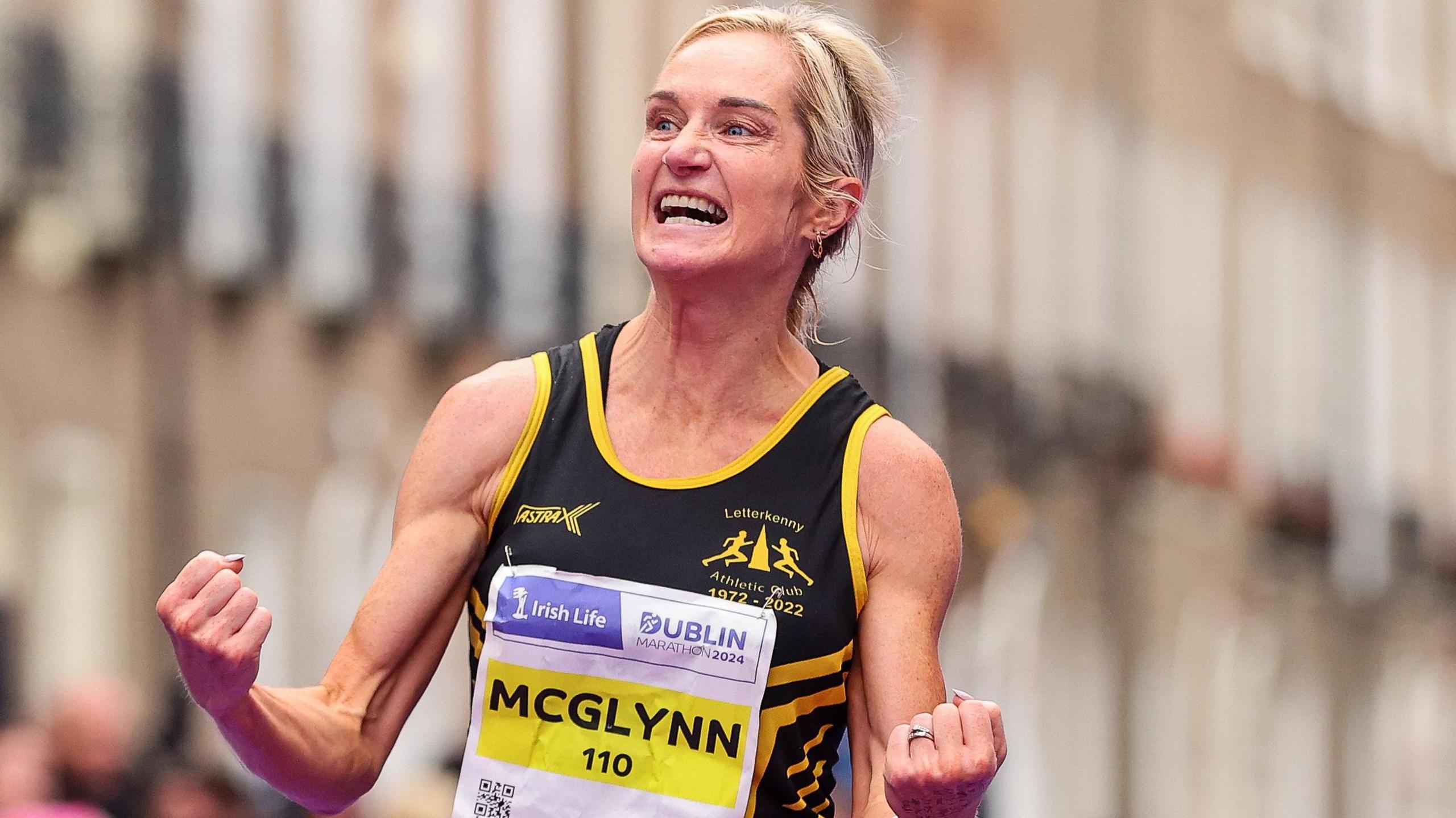 Ann-Marie McGlynn celebrates her Irish title triumph at the Dublin Marathon on 27 October