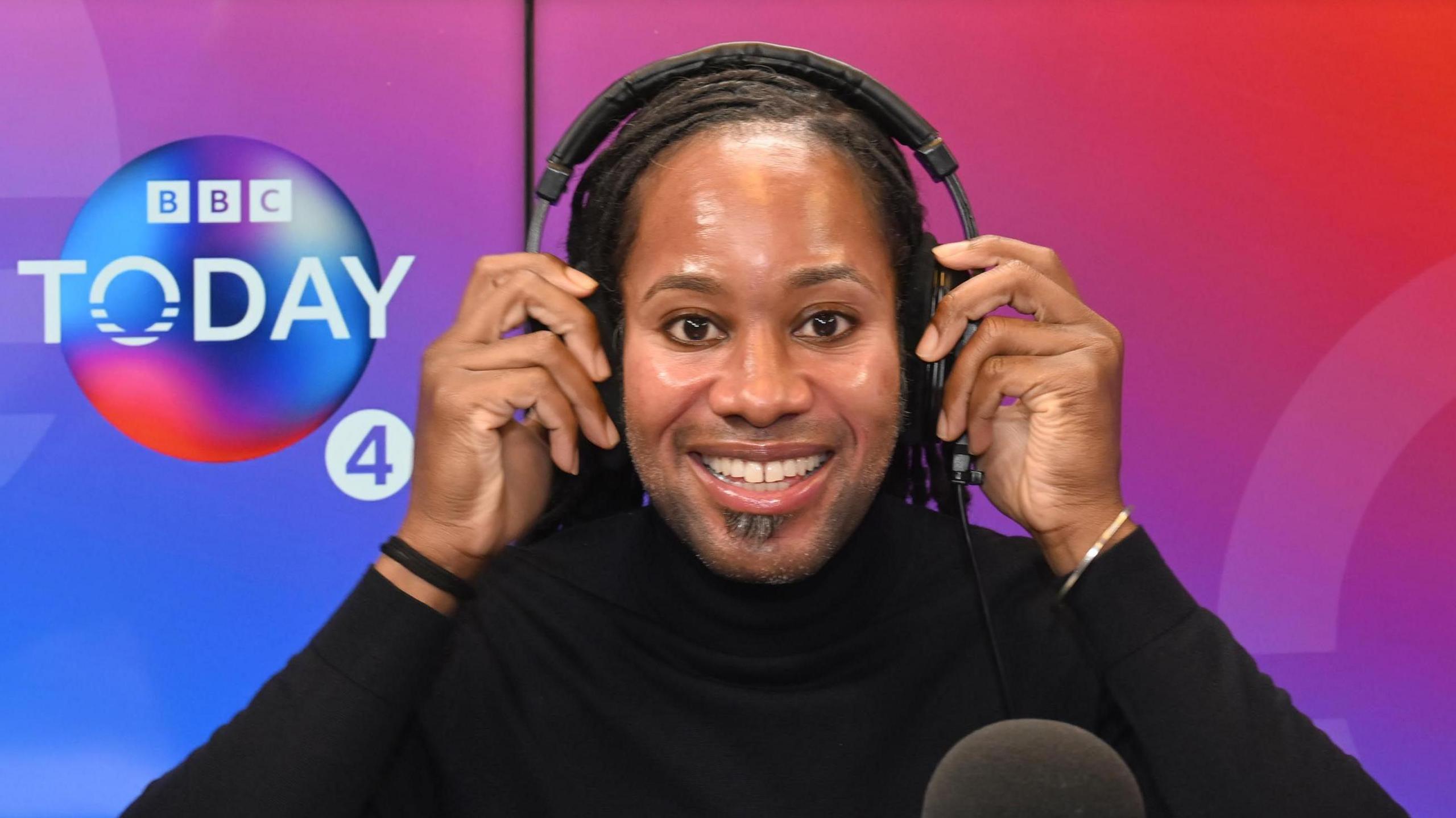 Jason Arday sits in a BBC Radio 4 studio wearing headphones beside a microphone during an appearance on the Today programme.