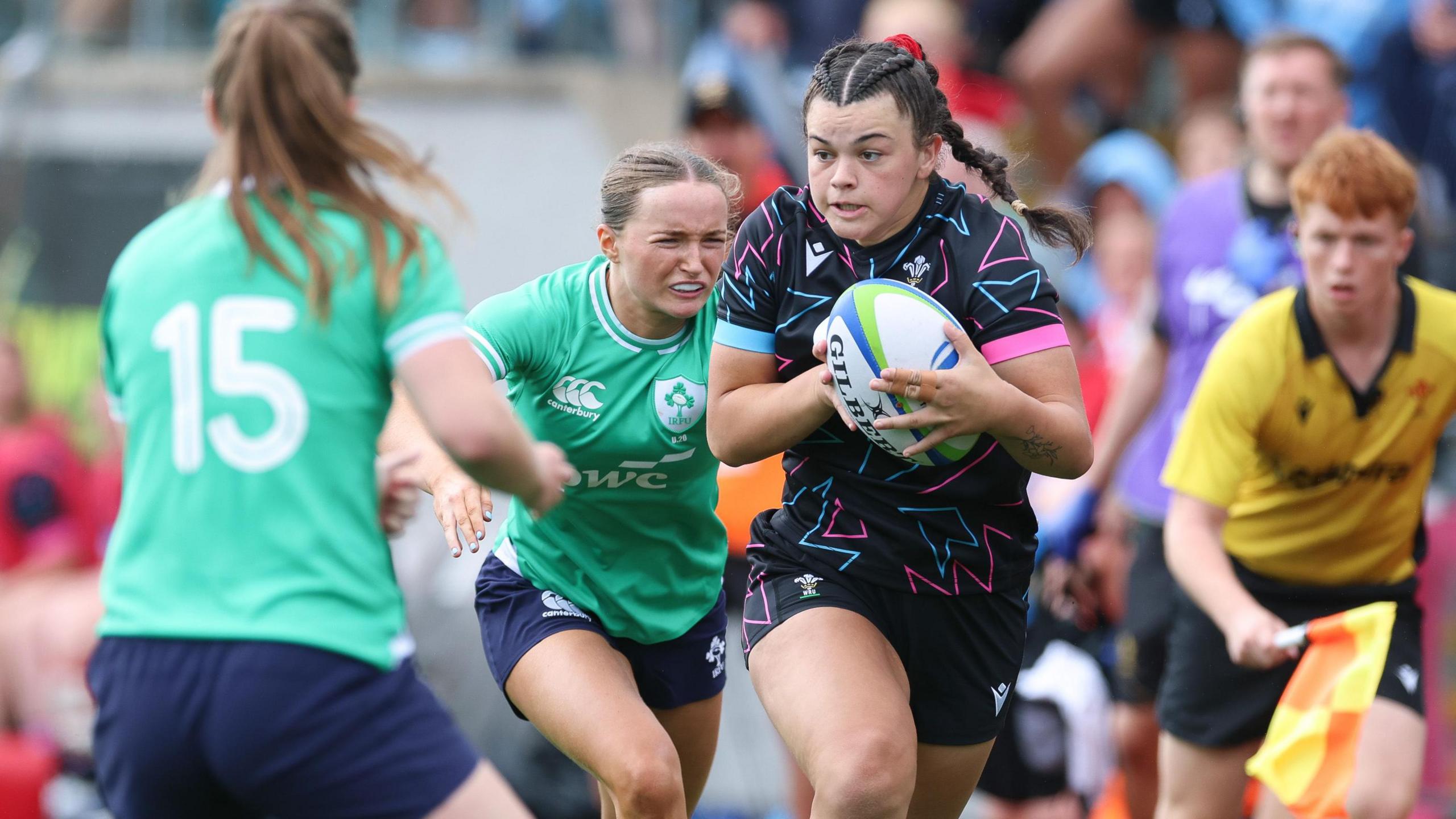 Wales' Chiara Pearce takes on Niamh Gallagher of Ireland in the Six Nations Summer Series game at Ystrad Mynach