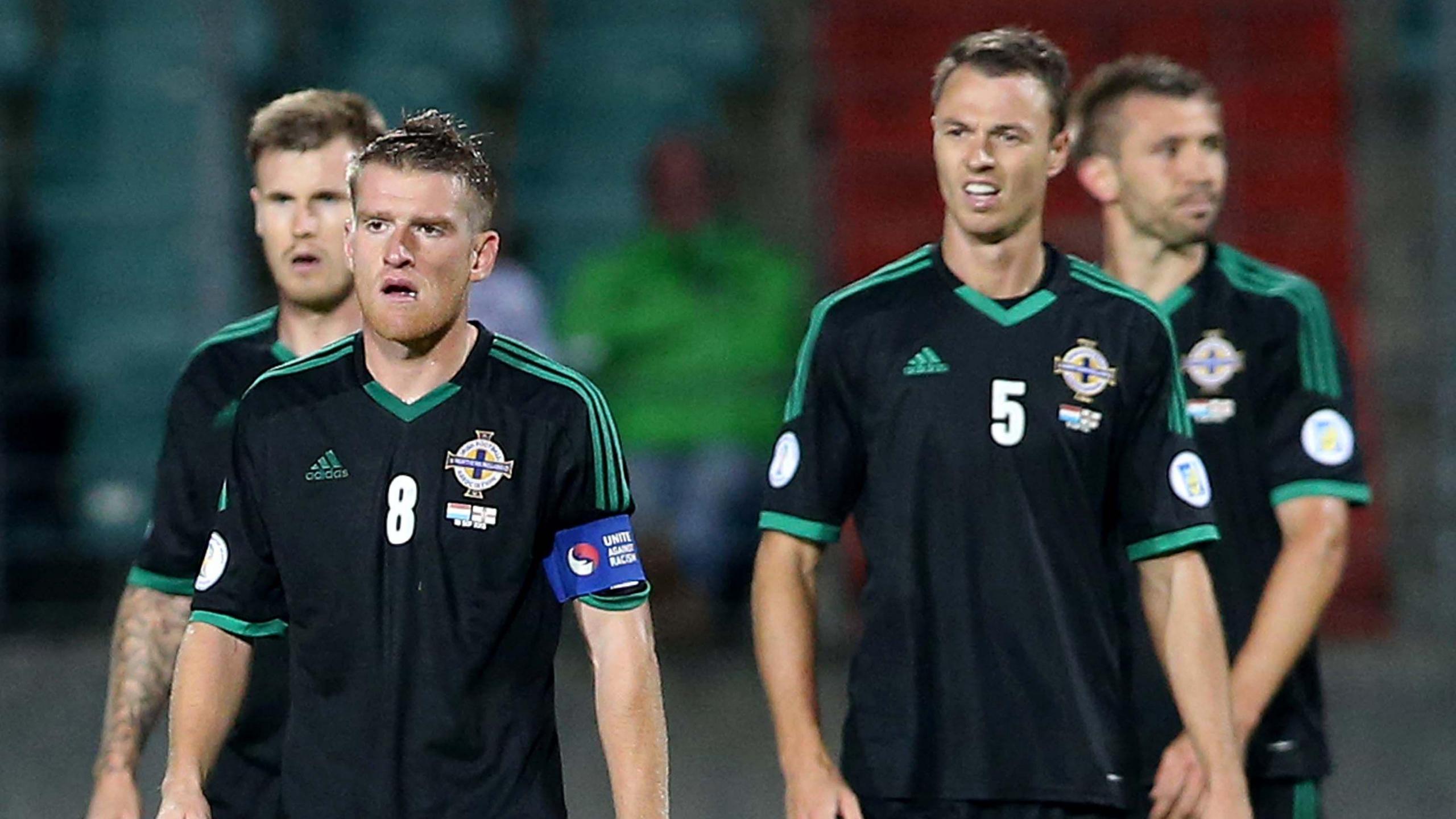 Steven Davis and Jonny Evans look dejected after Northern Ireland's 2013 defeat by Luxembourg