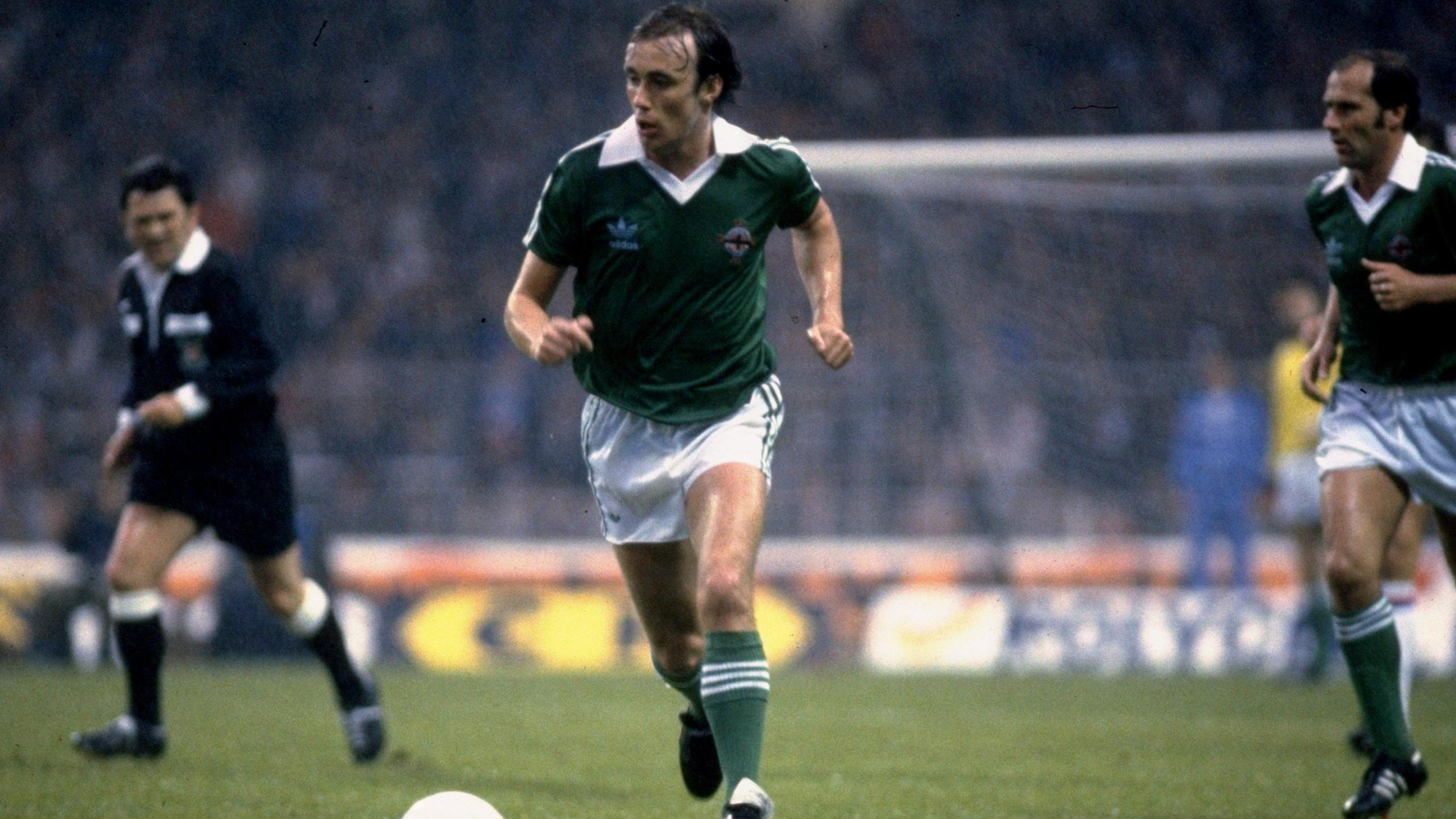 Sammy McIlroy in action for Northern Ireland