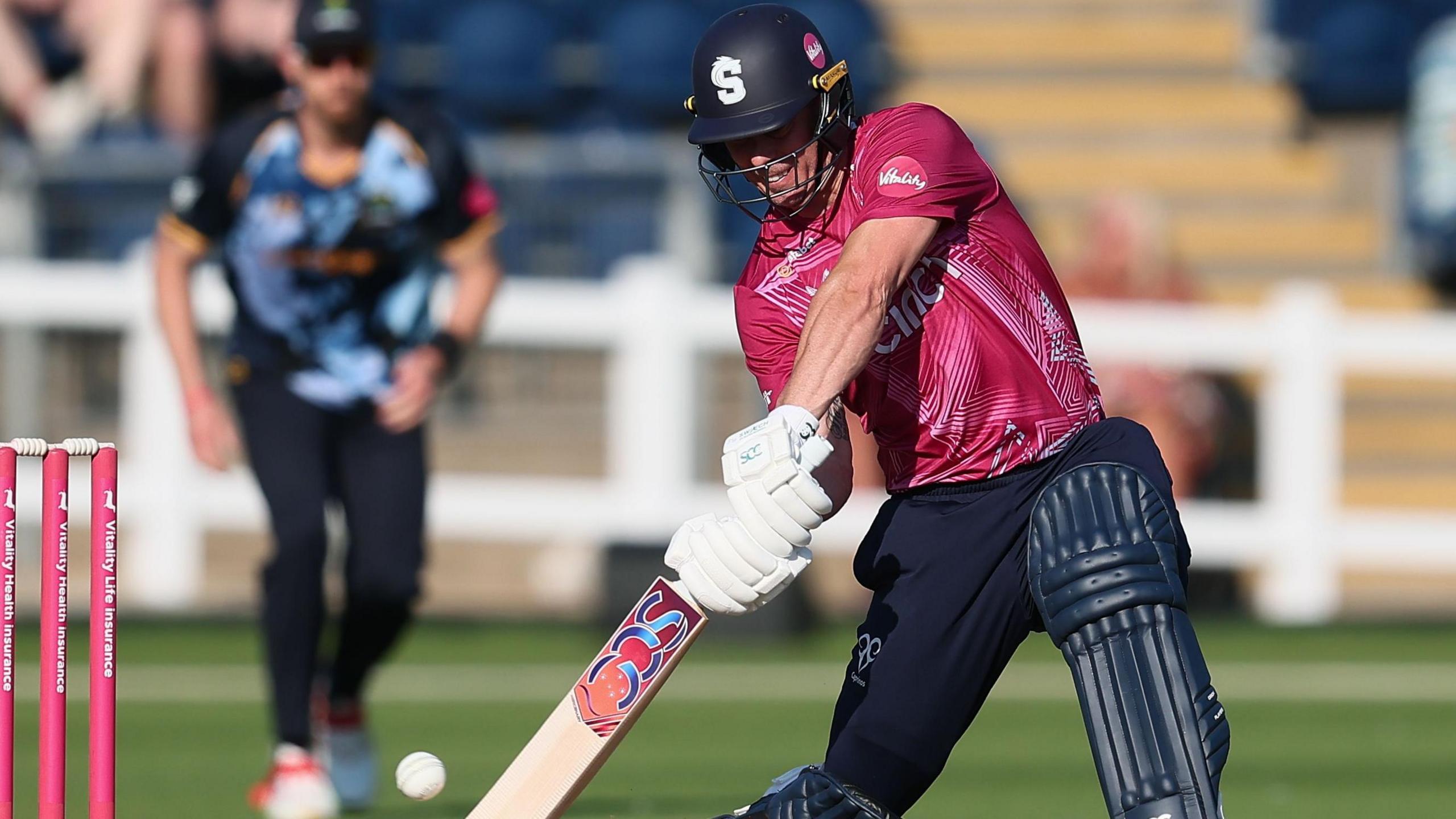 Chris Lynn, wearing Northamptonshire's red shirt, batting against Glamorgan