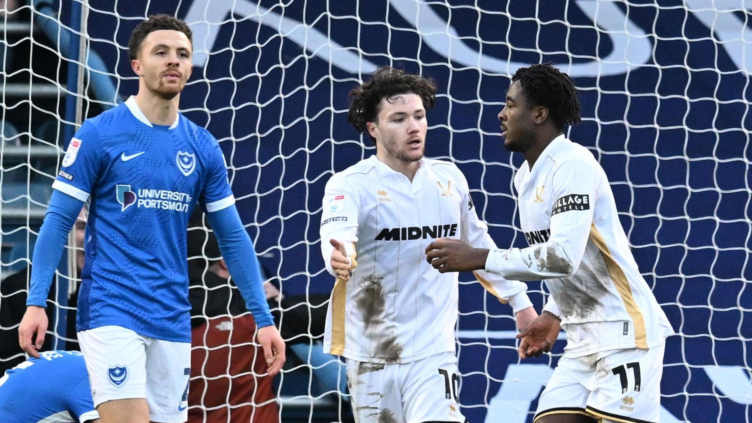 Andre Brooks (right) runs across the goal as he celebrates scoring a late winner for Sheffield United at Portsmouth
