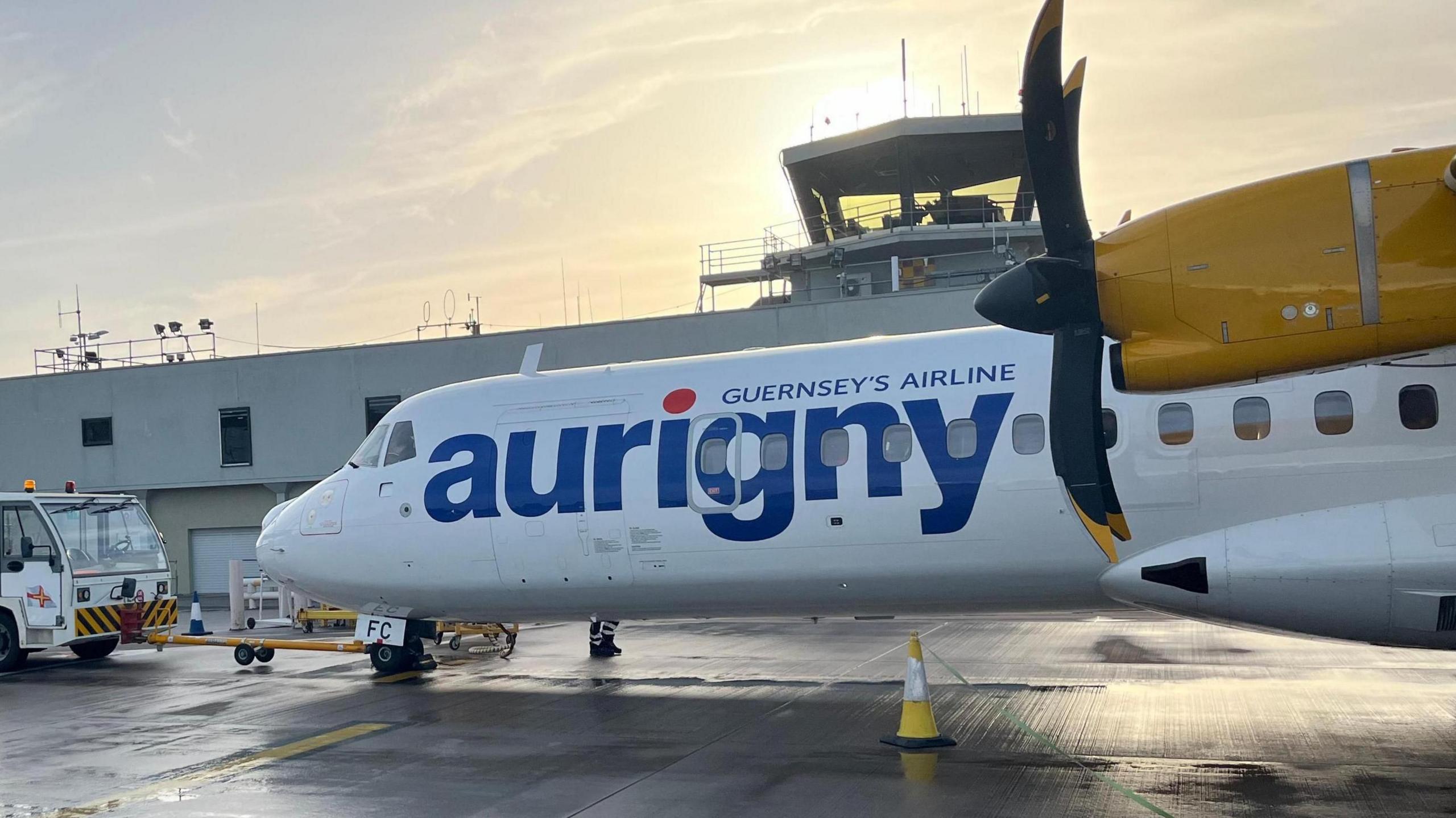 An Aurigny plane with 'Aurigny' written on it in big blue letters and 'Guernsey's Airline' written above.