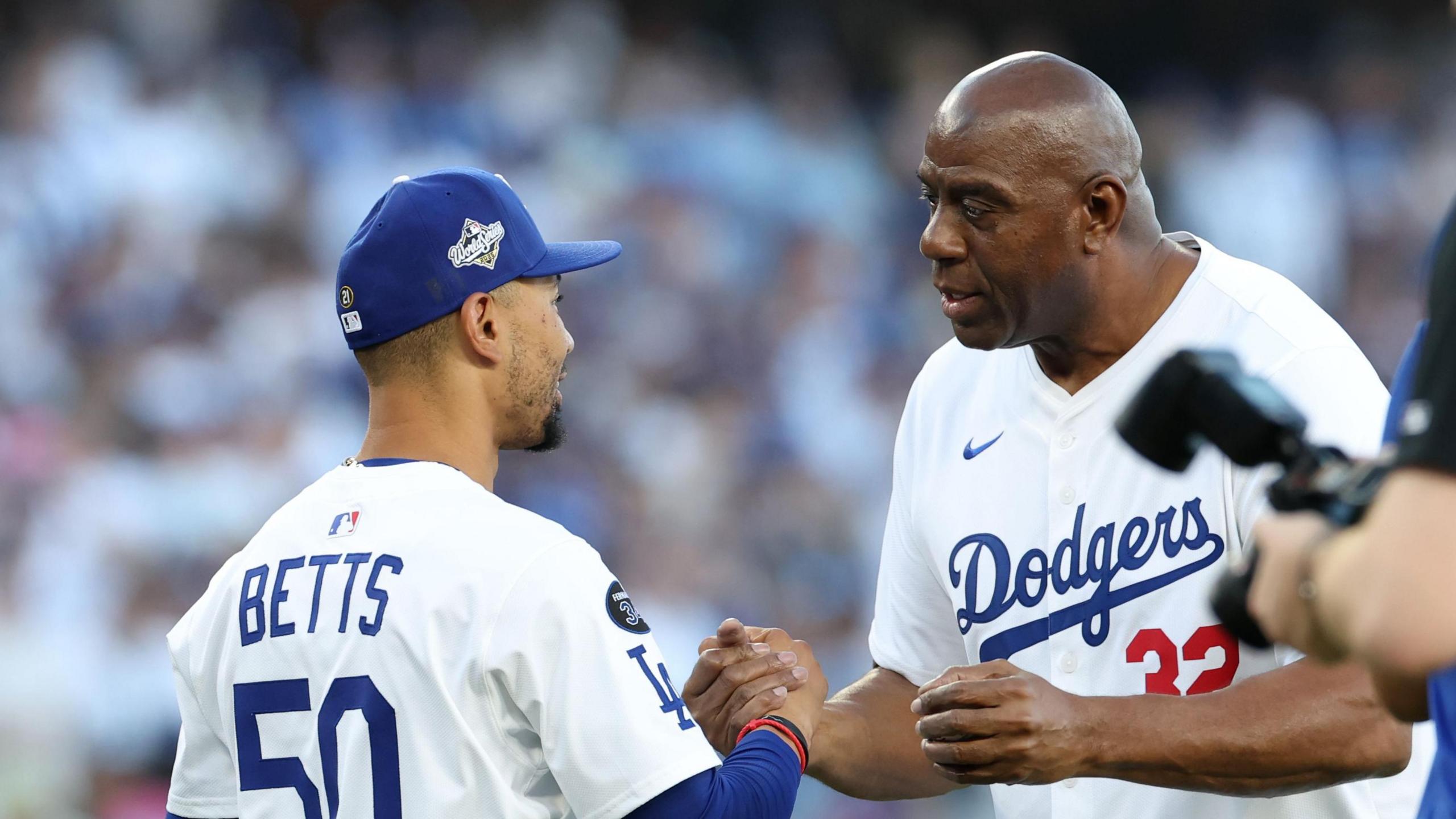 Los Angeles Dodgers shortstop Mookie Betts and basketball legend Magic Johnson