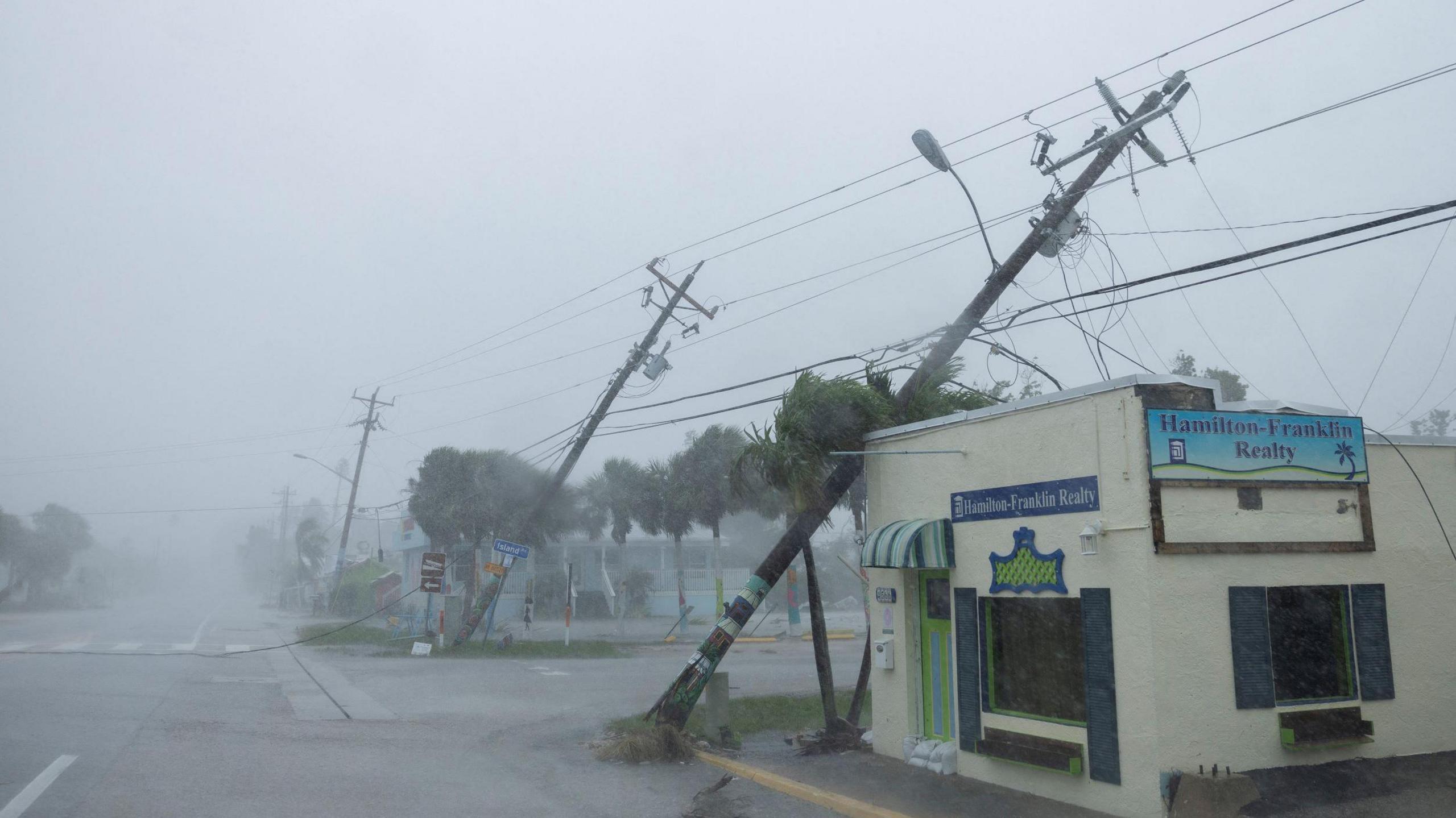 Power lines blown down on to an estate agent's office by strong winds