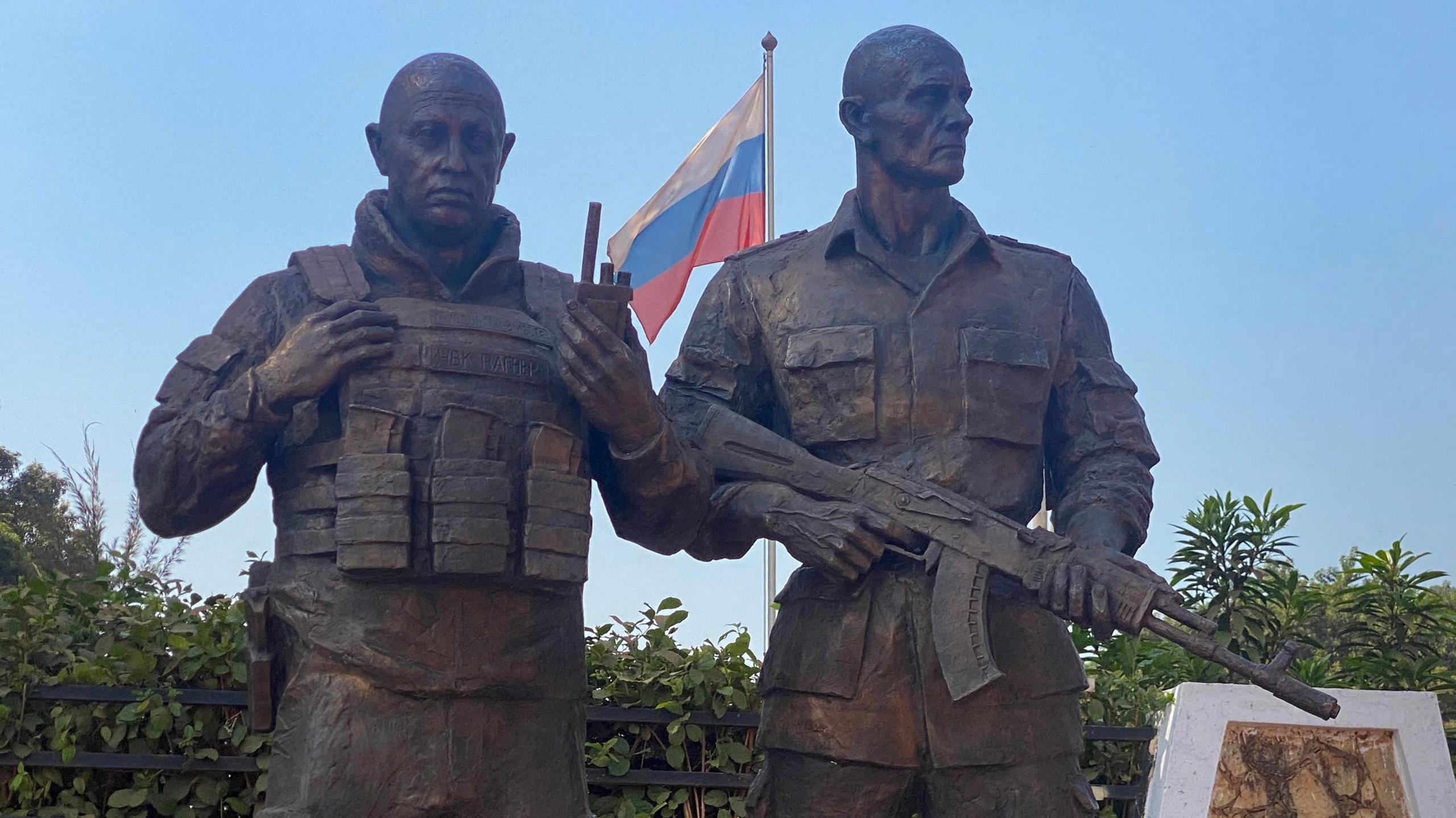 A bronze statue in the likeness of the late Wagner private mercenary group chief Yevgeny Prigozhin (L), and his right-hand man Dmitru Utkin (R), erected in front of the Maison Russe Russian House in Bangui.