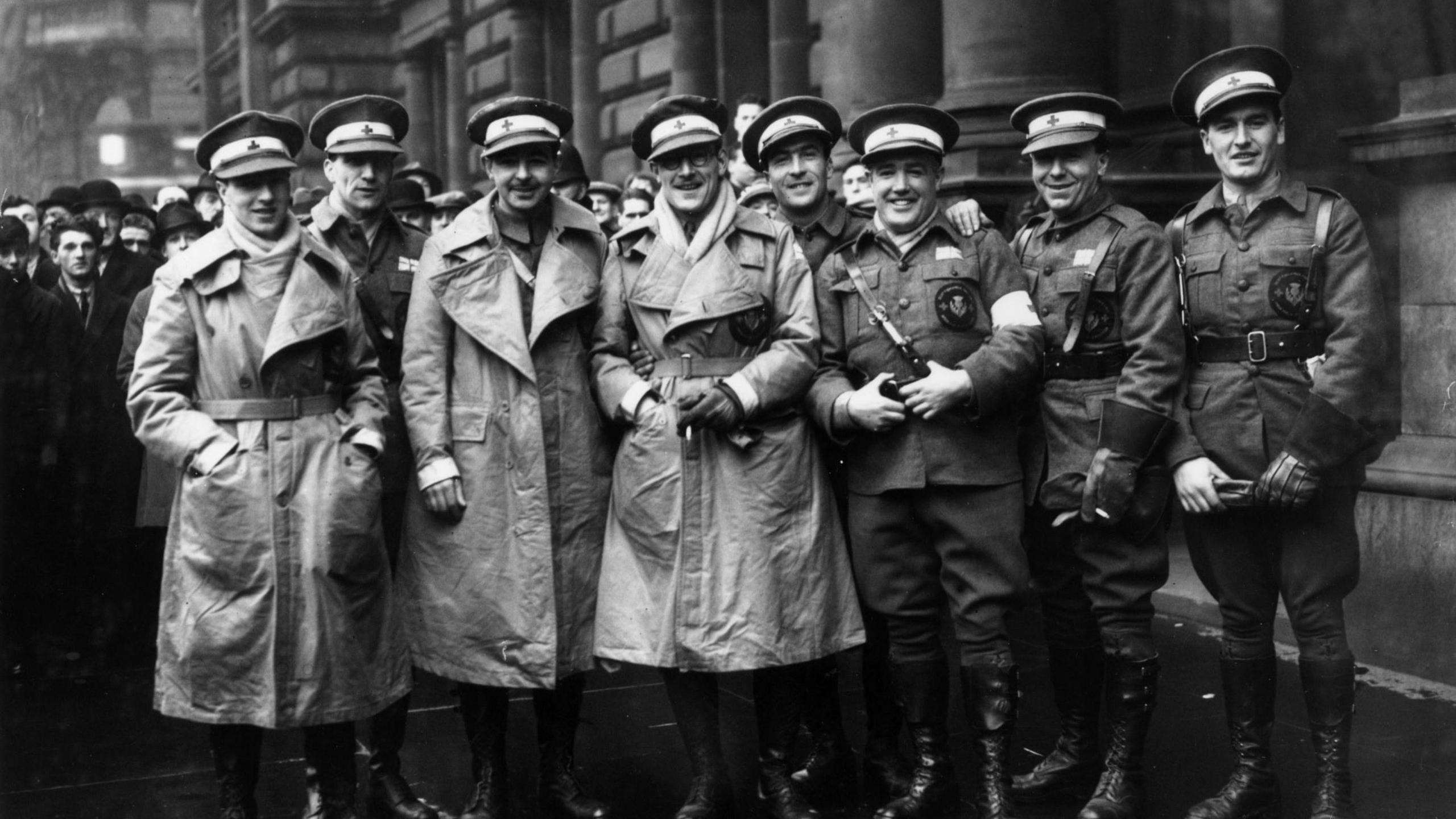 Members of a Scottish ambulance unit in Glasgow before their second visit to the Spanish Civil War - the eight men are wearing hats and military uniforms