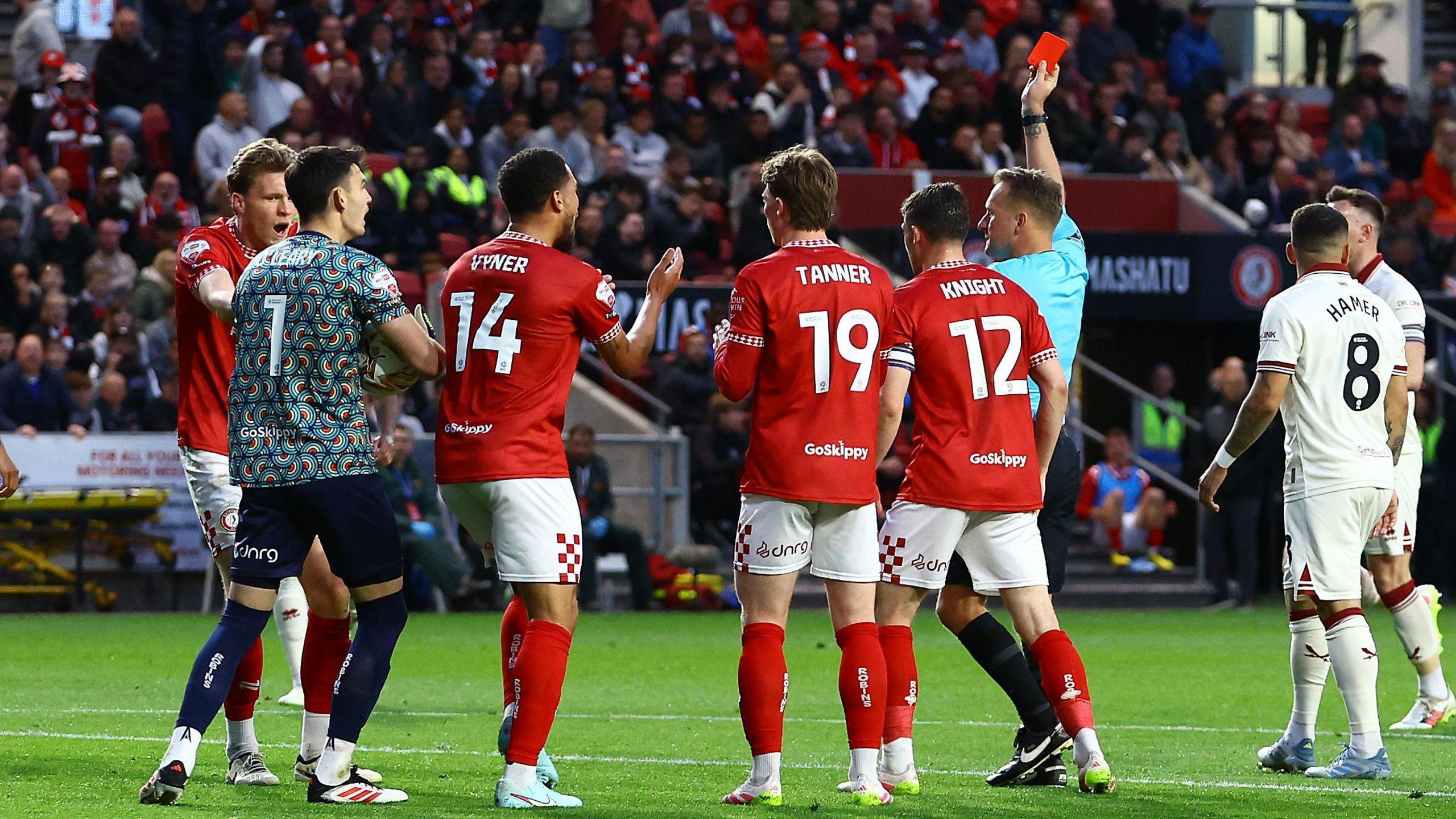 Rob Dickie is shown a red card