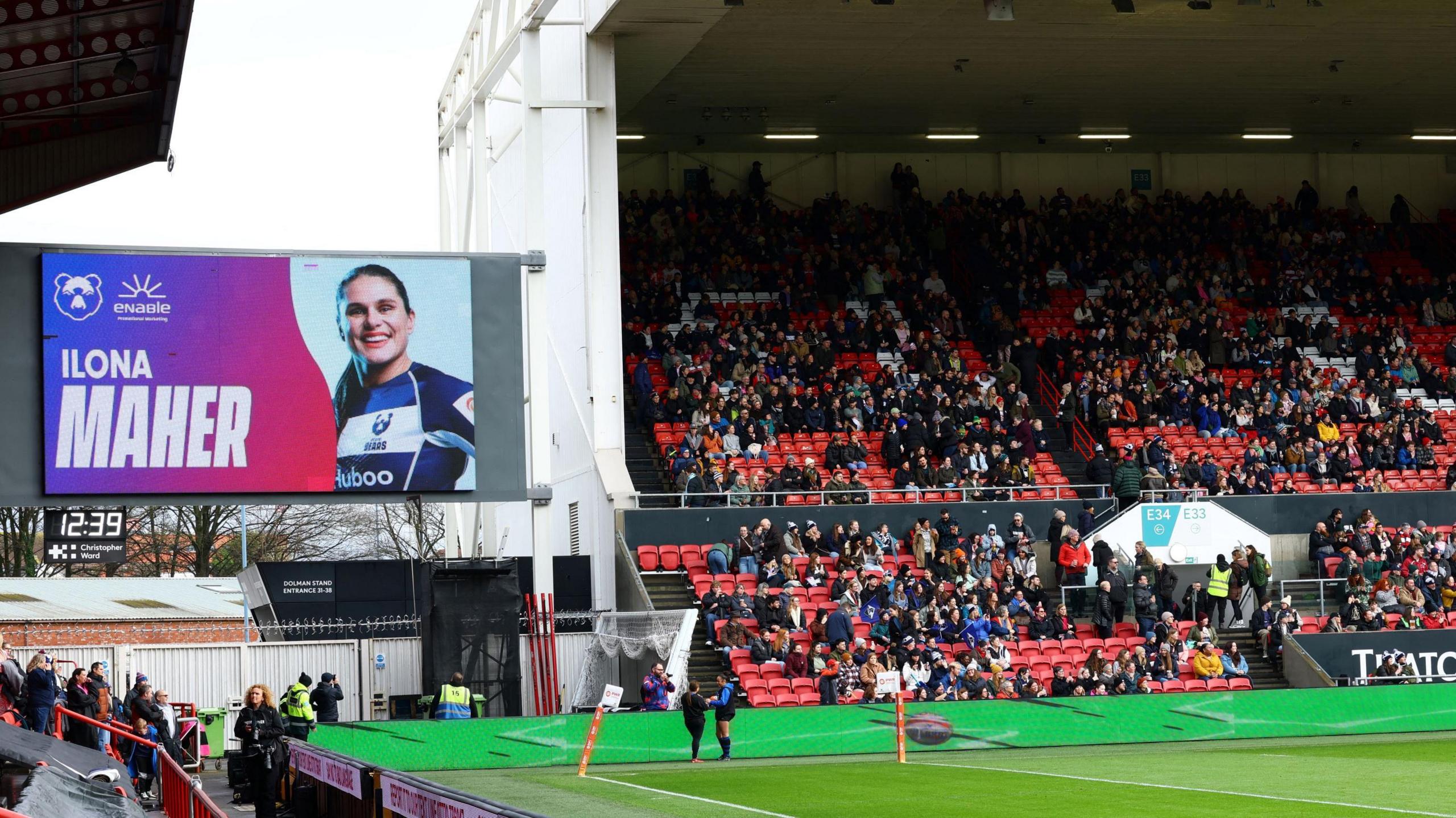 A screen inside Ashton Gate shows Ilona Maher's photo before kick-off