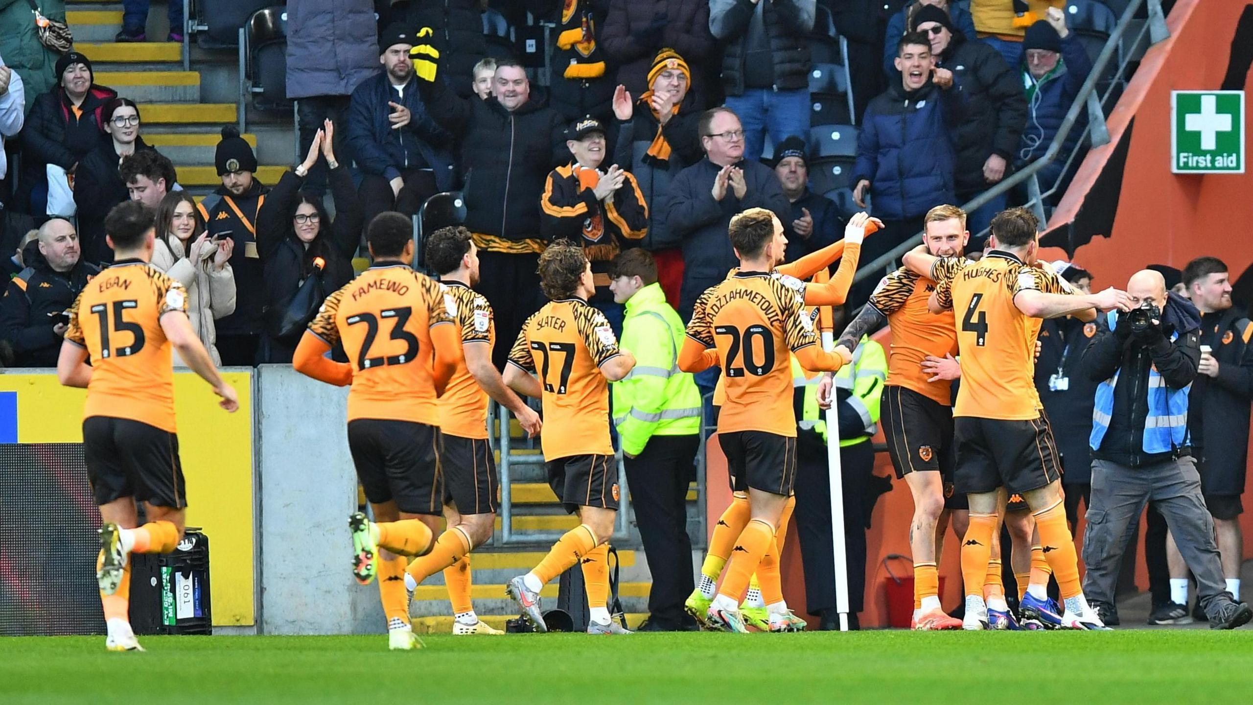 Hull players celebrate with Oli McBurnie 
