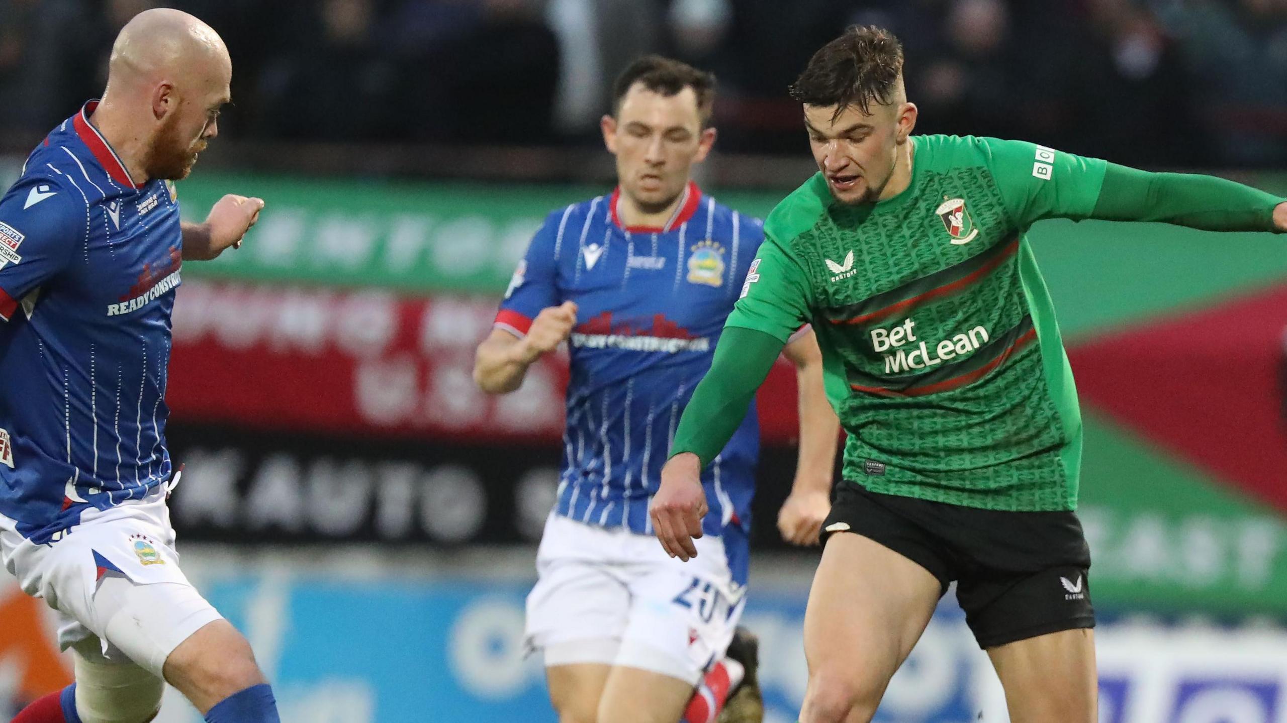 Action from Glentoran v Linfield on Boxing Day