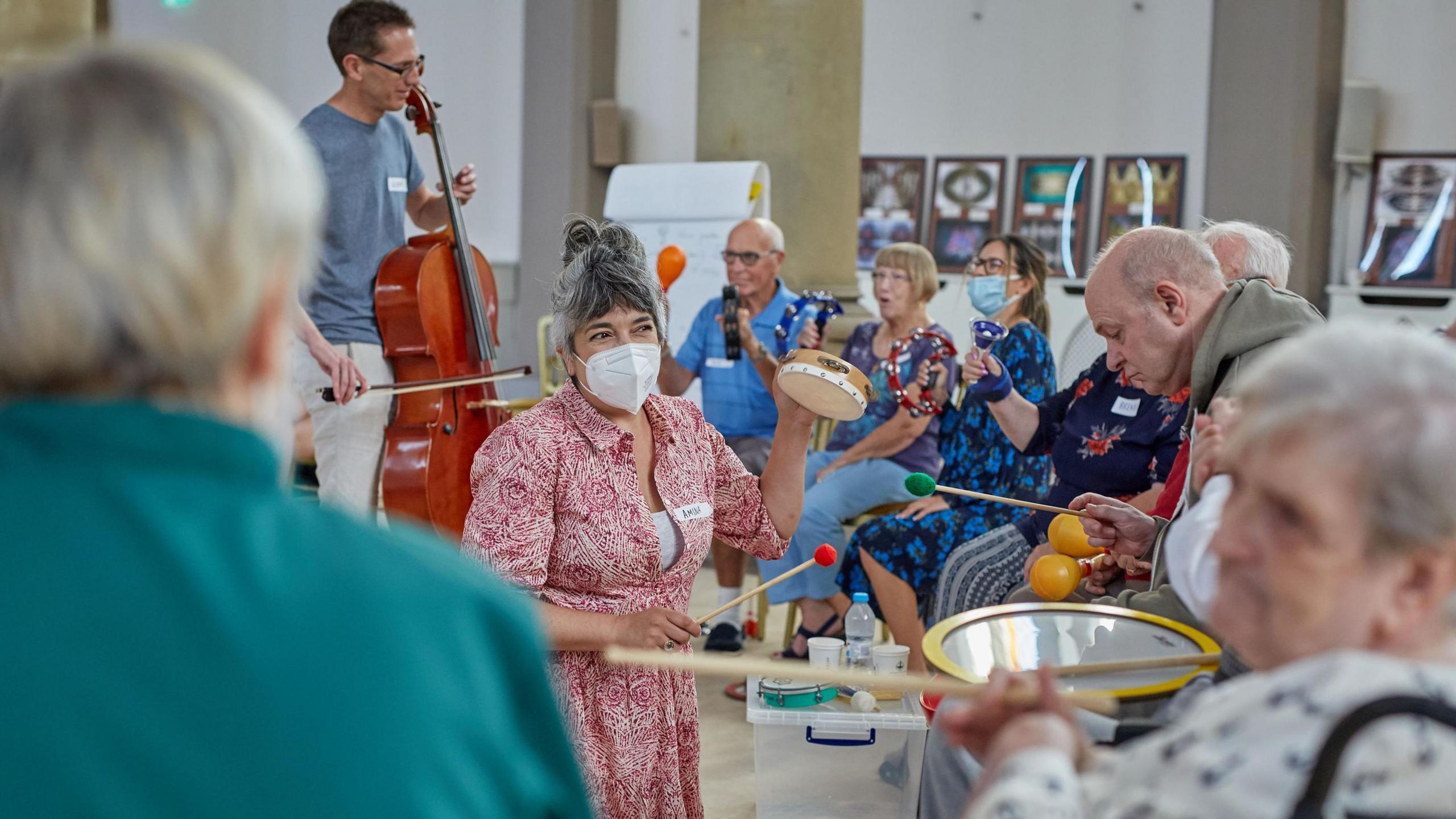 Undated handout photo issued by Manchester Camerata's Music in Mind music café in The Monastery, Gorton, of individuals in a music therapy session.