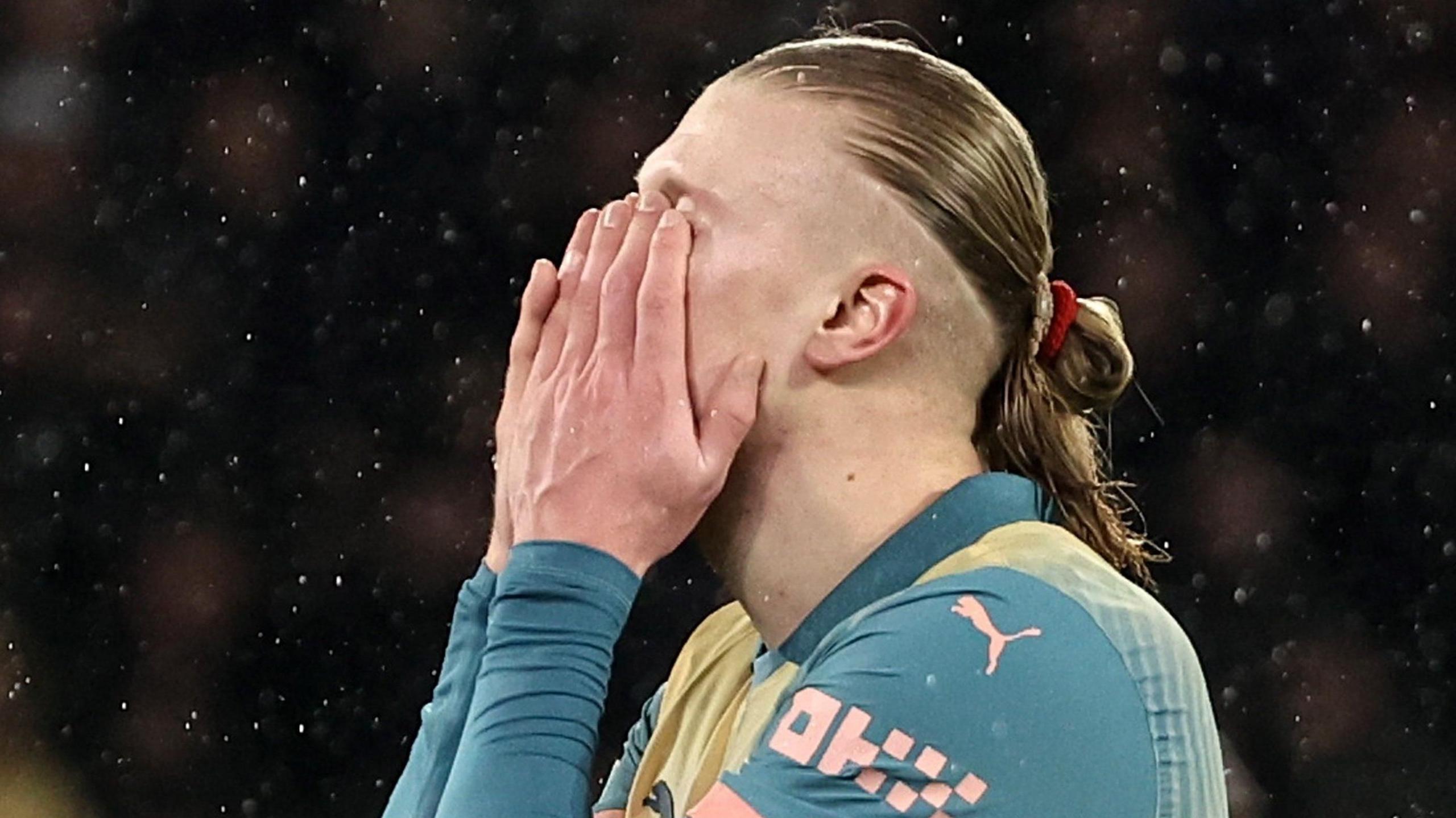 Manchester City striker Erling Haaland covers his face with his hands during the 4-2 defeat by Paris St-Germain