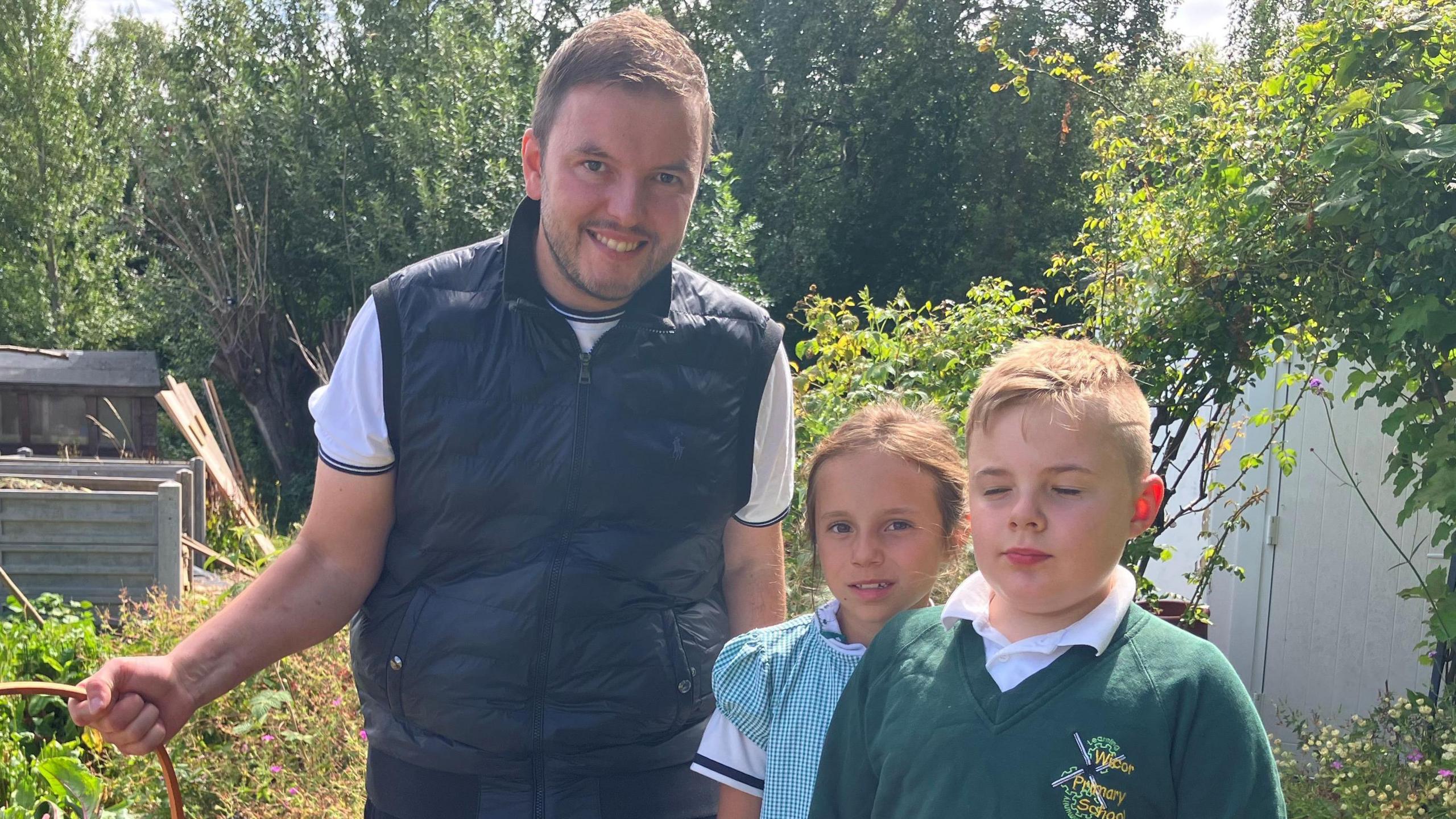 Children from Wicor Primary School stood alongside Adam Maker, head chef at the A Bar picking fruit and veg in the garden