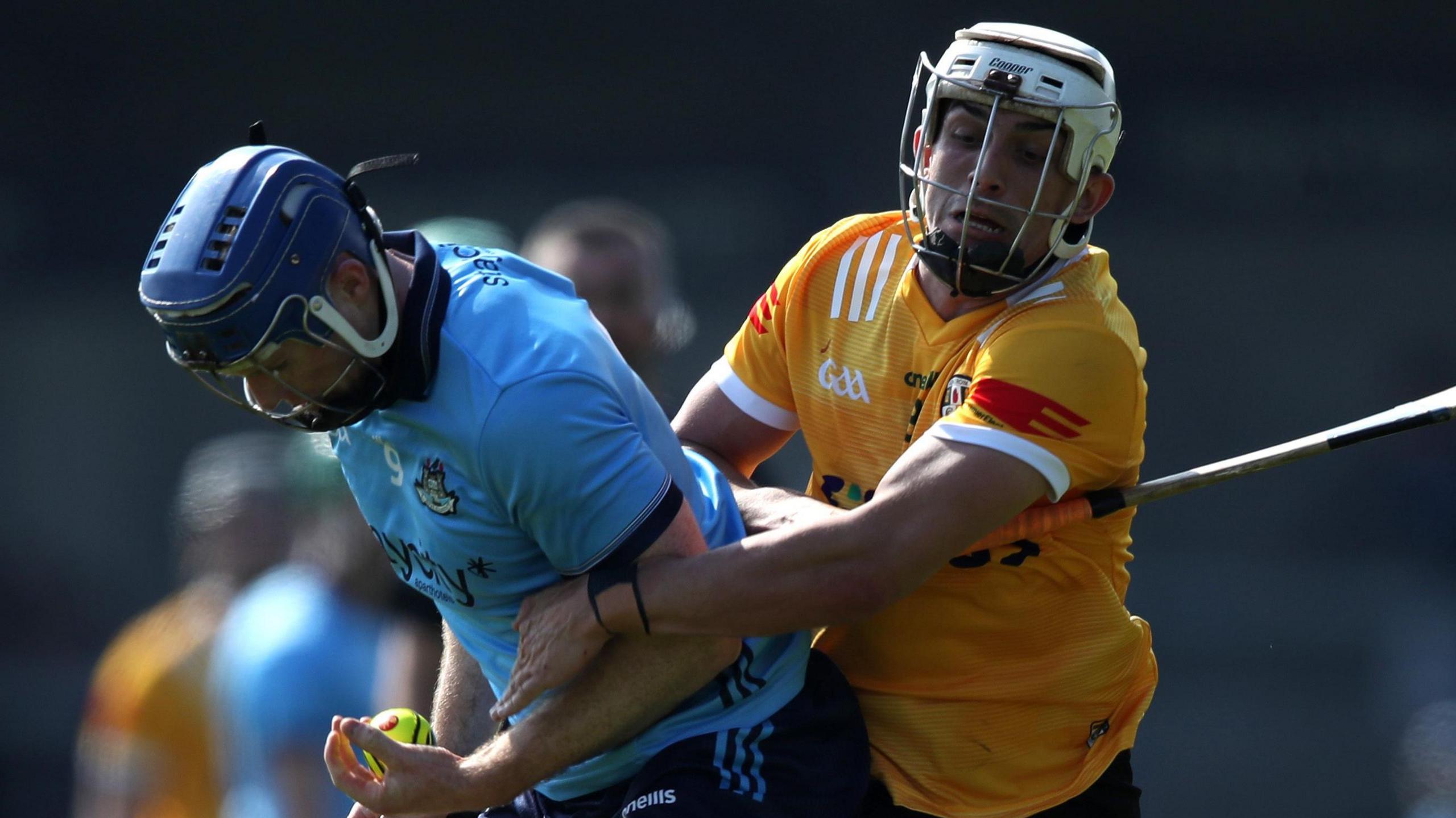 Antrim's Seaan Elliott tackles Conor Burke of Dublin