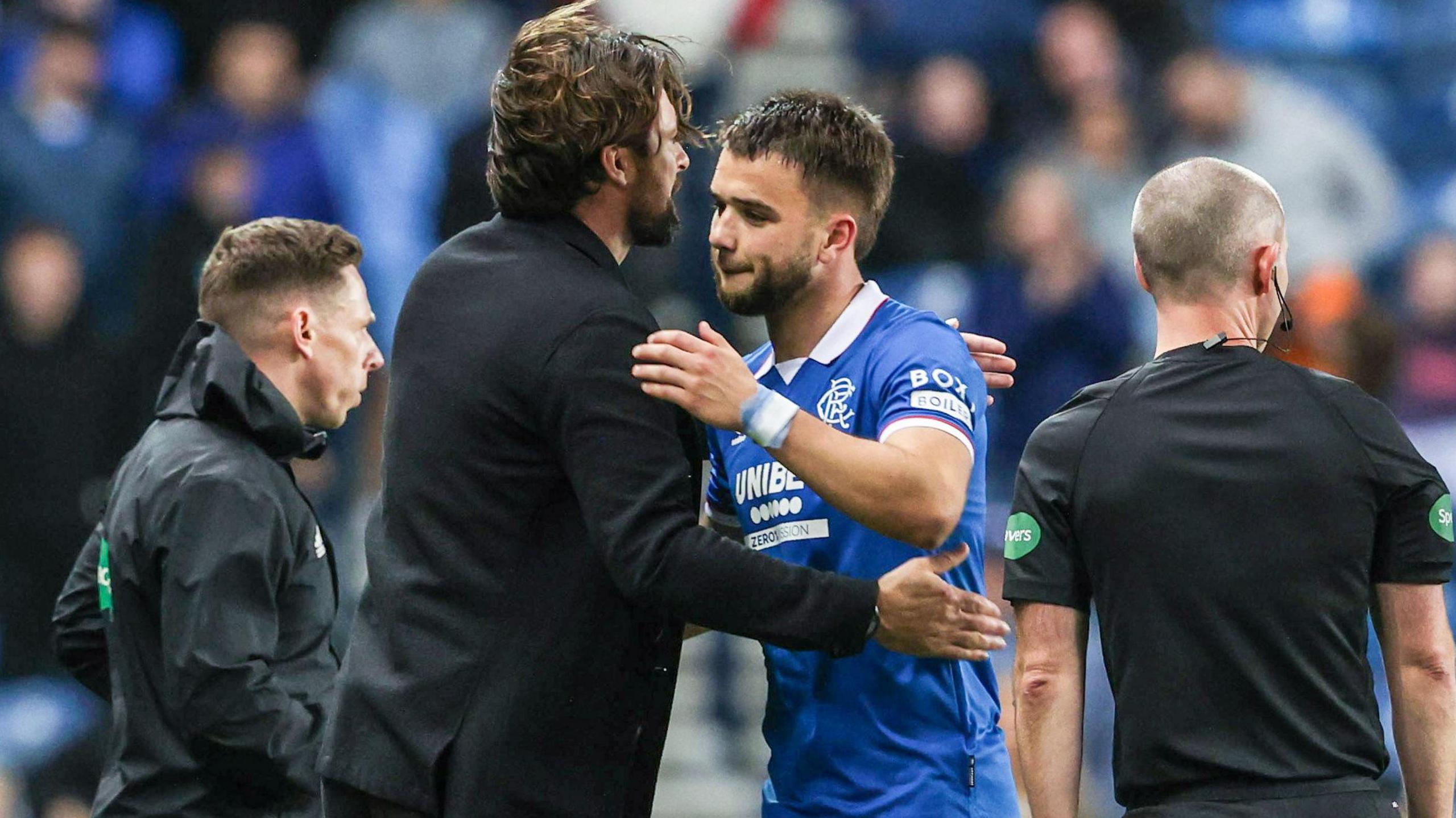 Russell Martin and Nico Raskin embrace as the midfielder is substituted