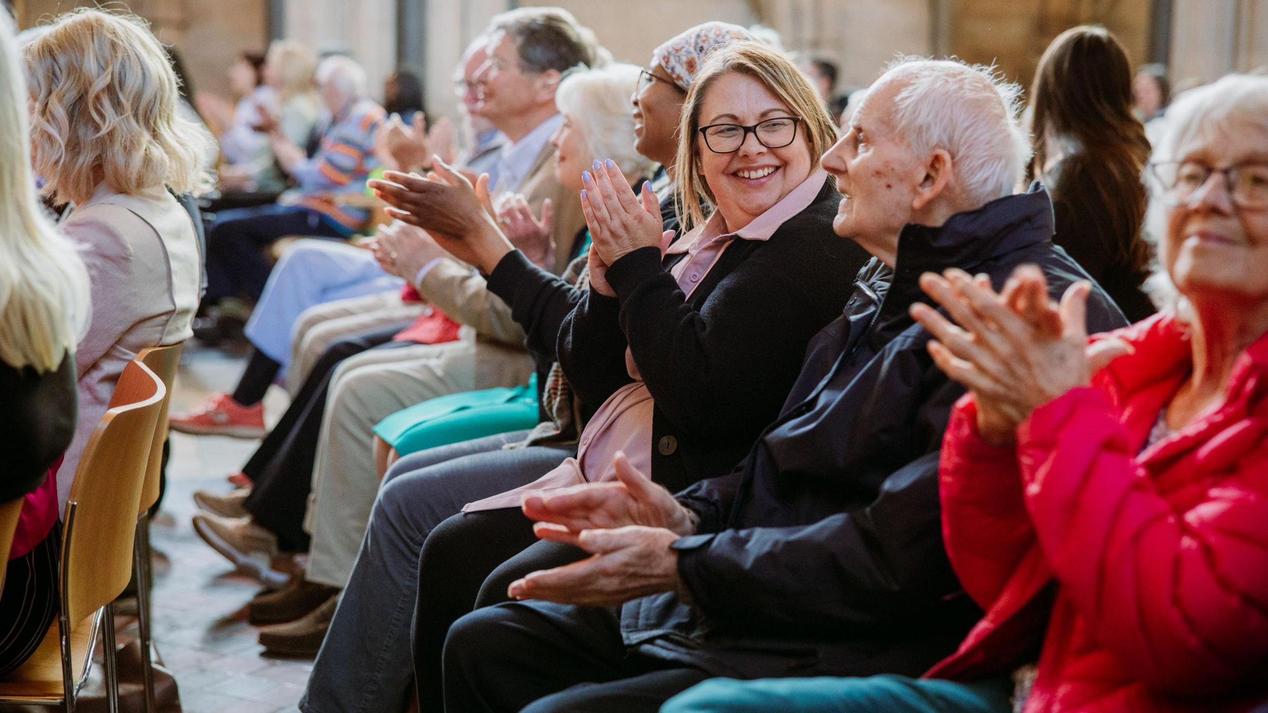 Care home residents clapping