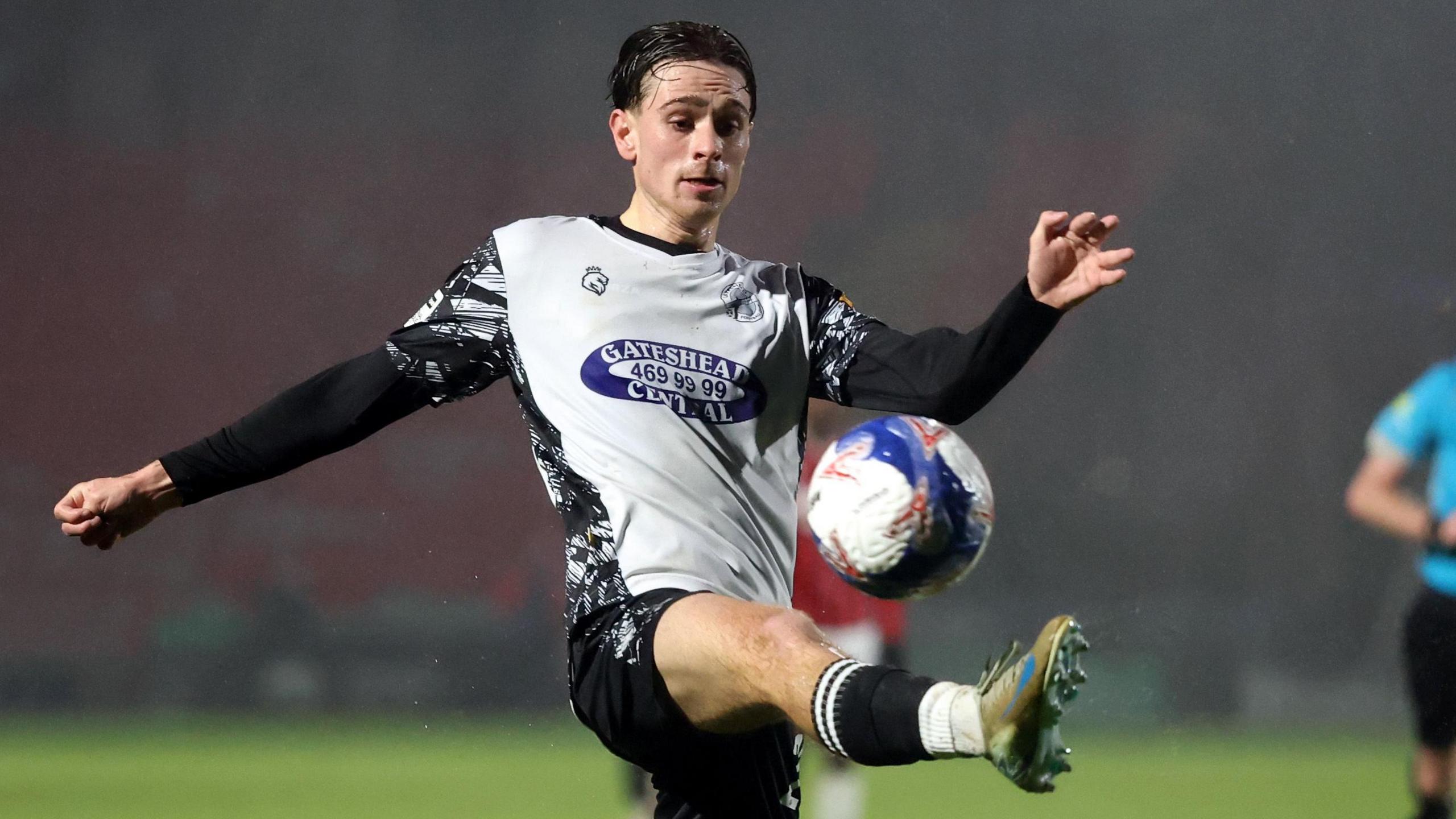 Fenton John controls the ball while playing for Gateshead 