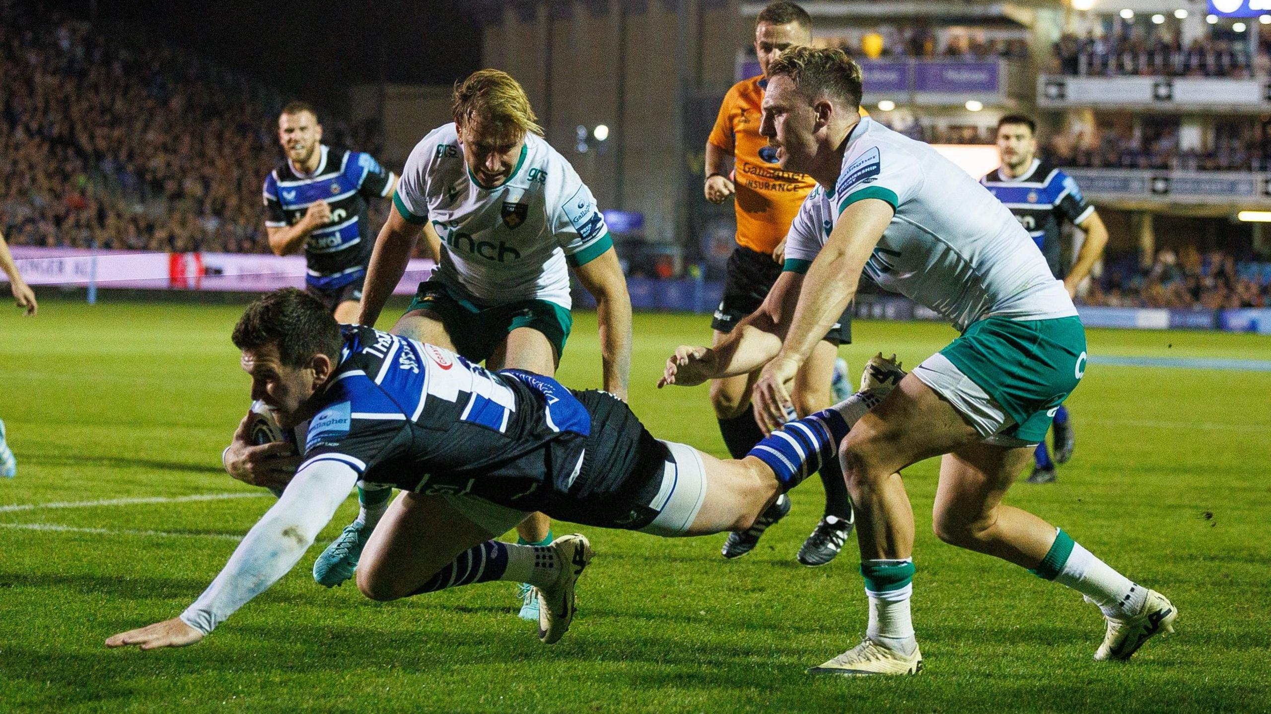 Ben Spencer dives over for a try against Northampton