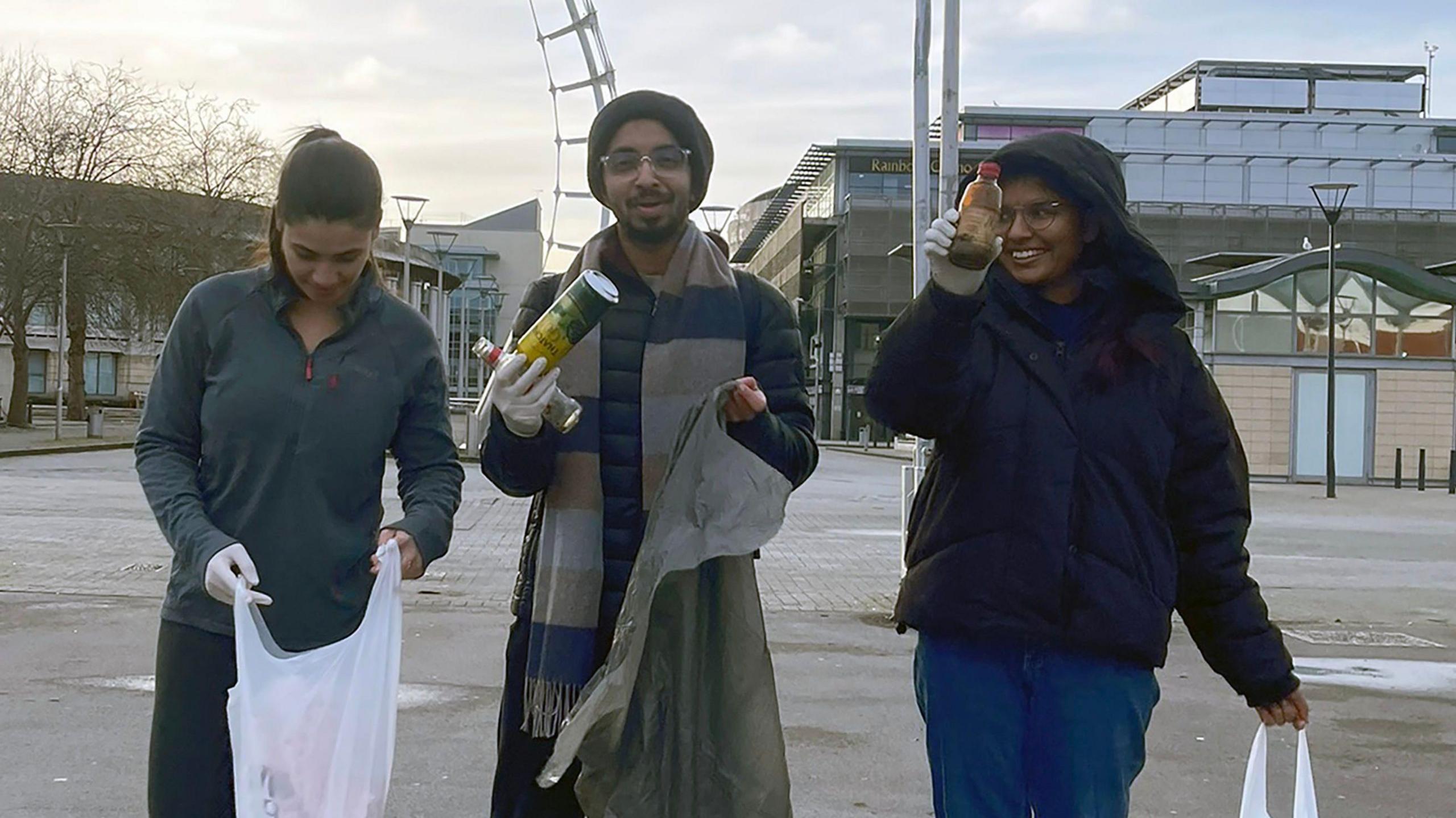 Vivek and two friends litter picking 