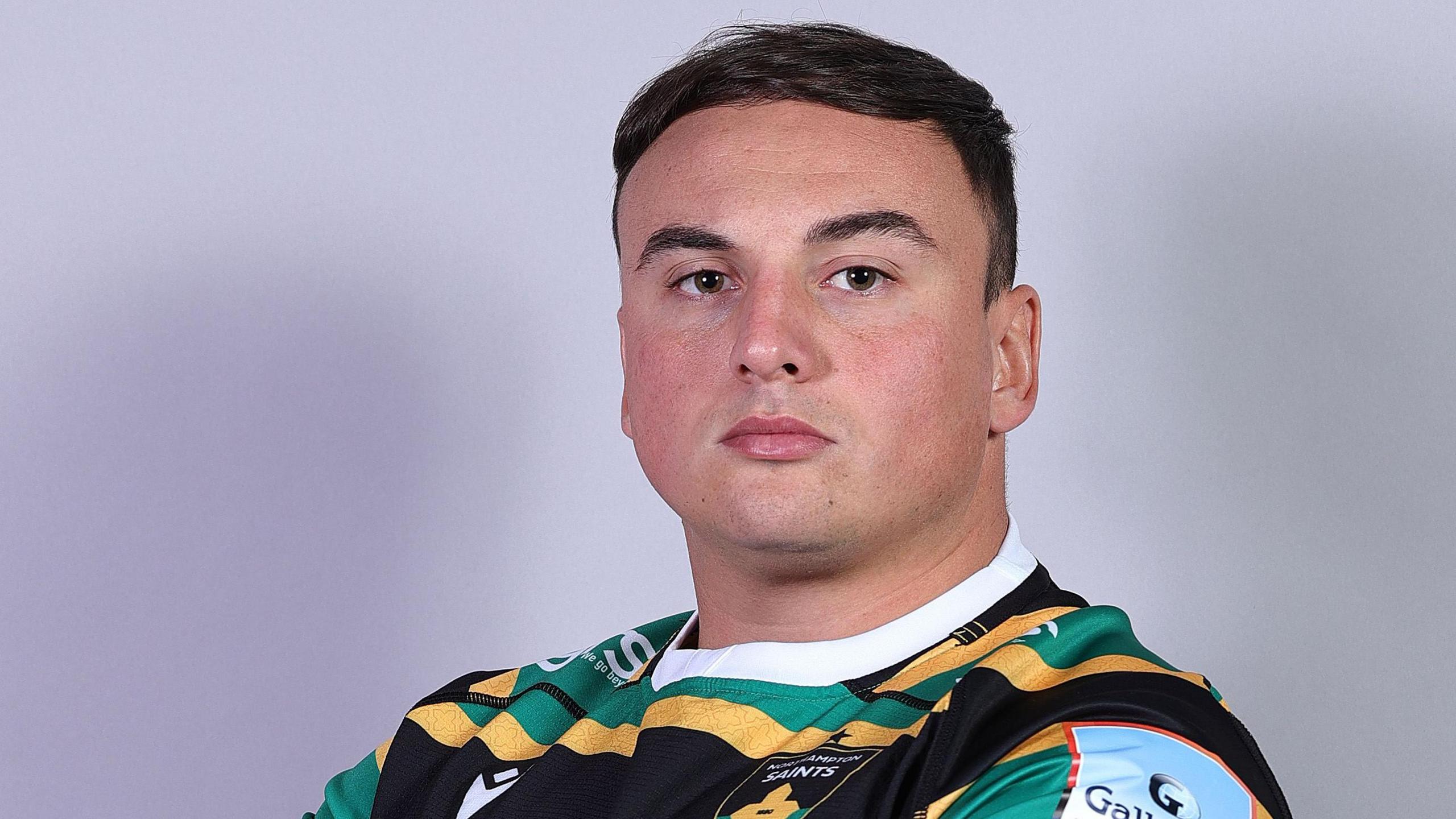 Marco Manfredi wearing a Northampton Saints shirt