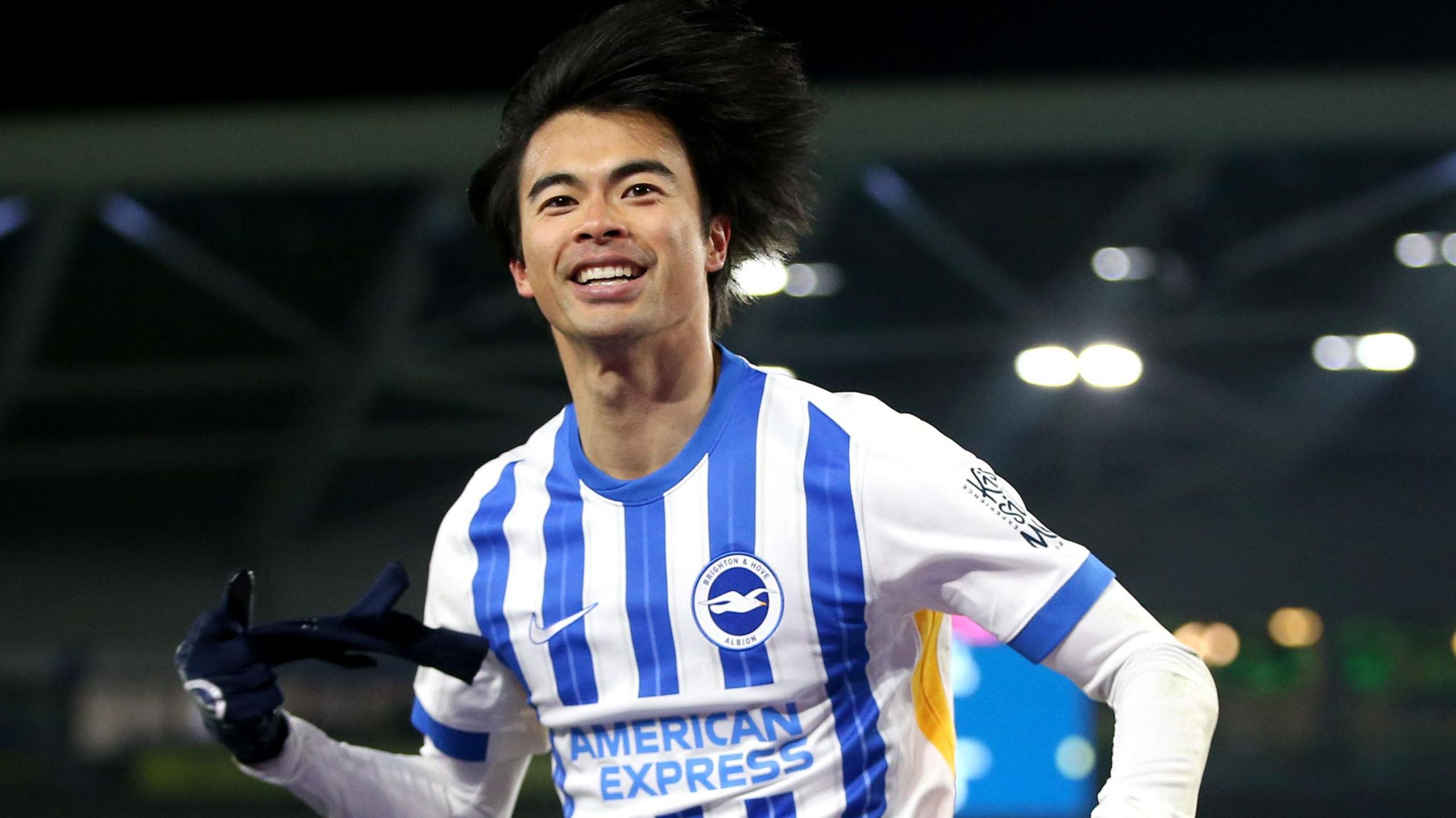 Kaoru Mitoma celebrates scoring 