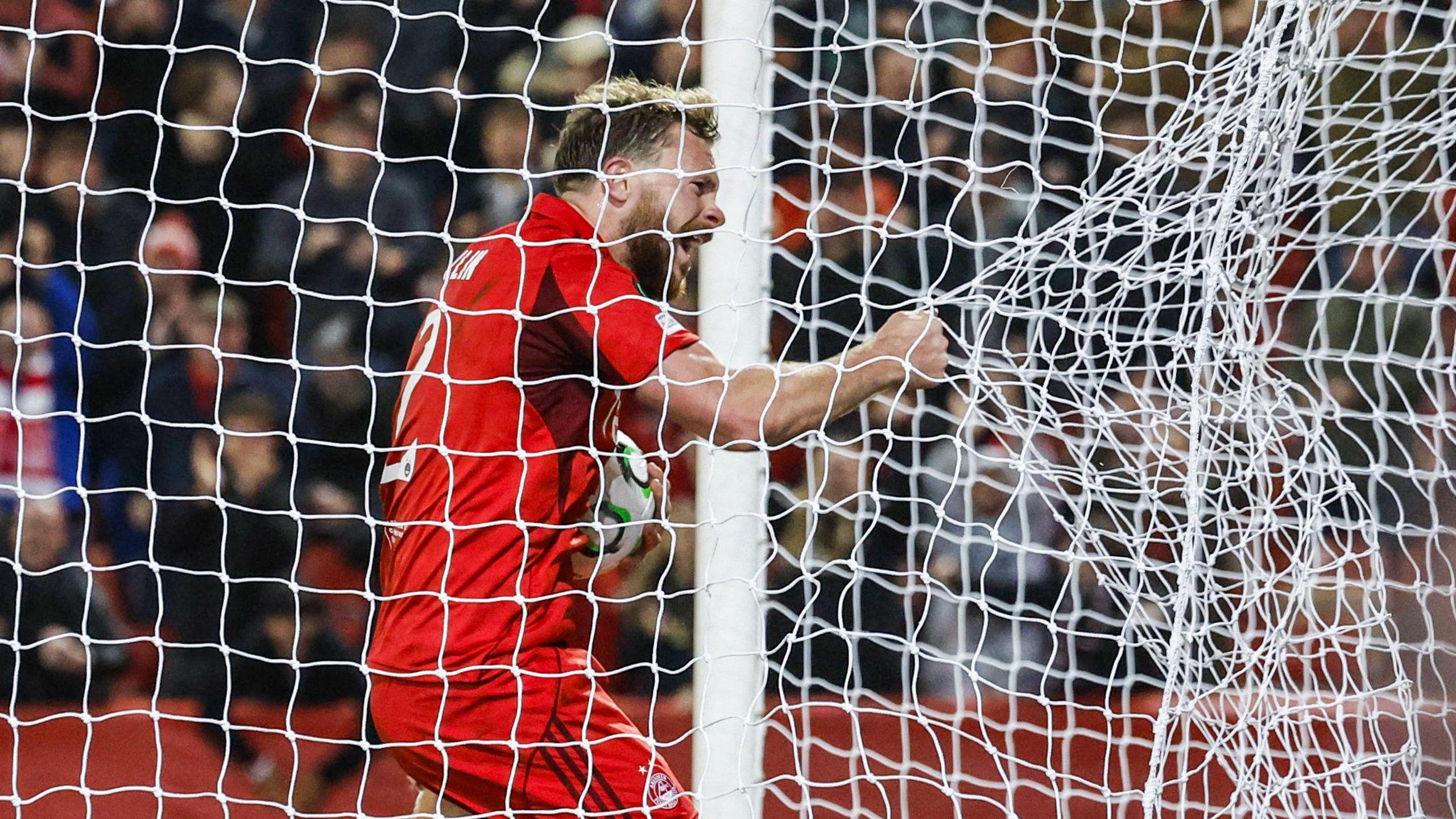 Aberdeen's Nicky Devlin celebrates after scoring to make it 3-2 