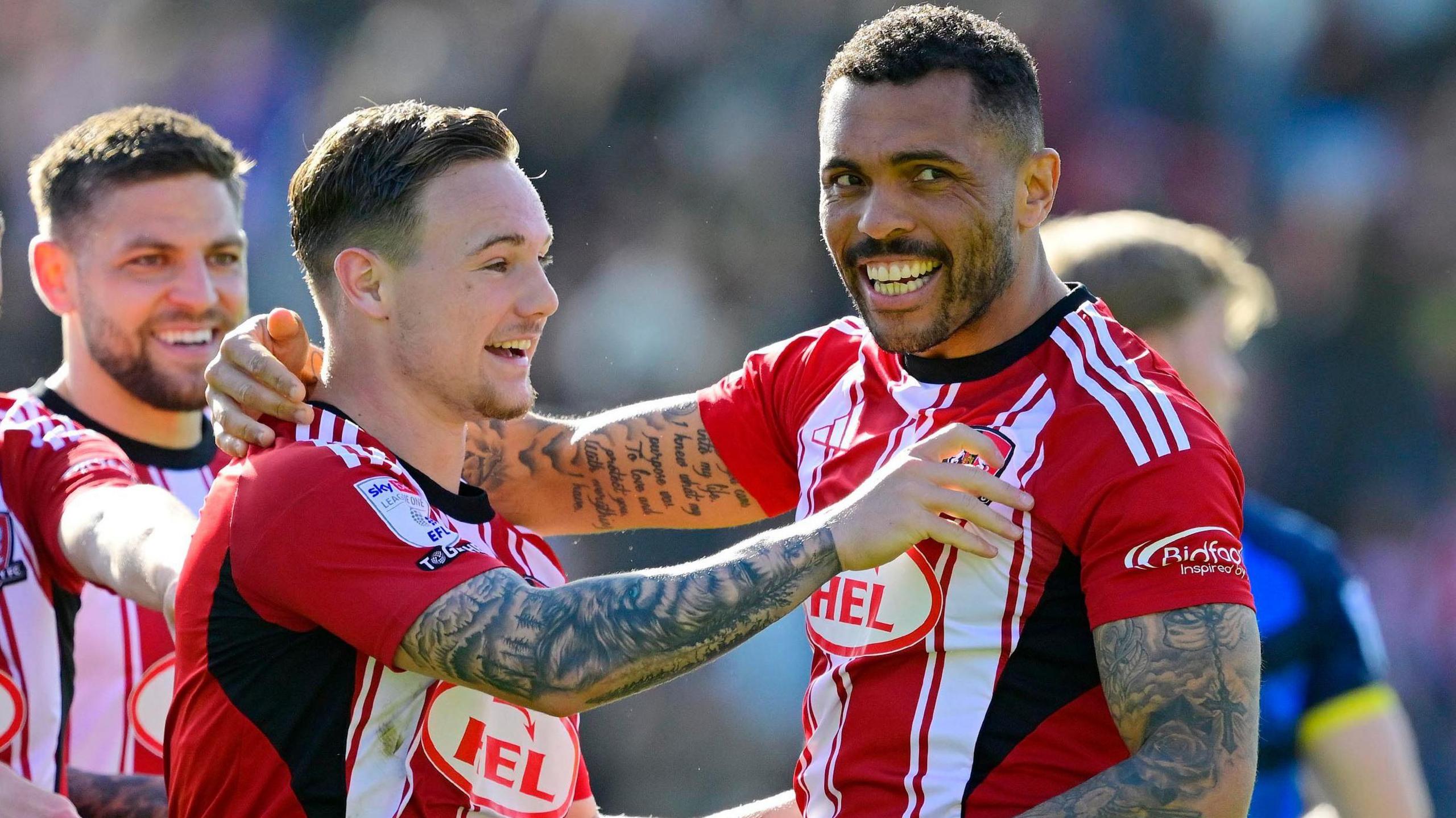 Jayden Wareham (left) and Josh Magennis celebrate