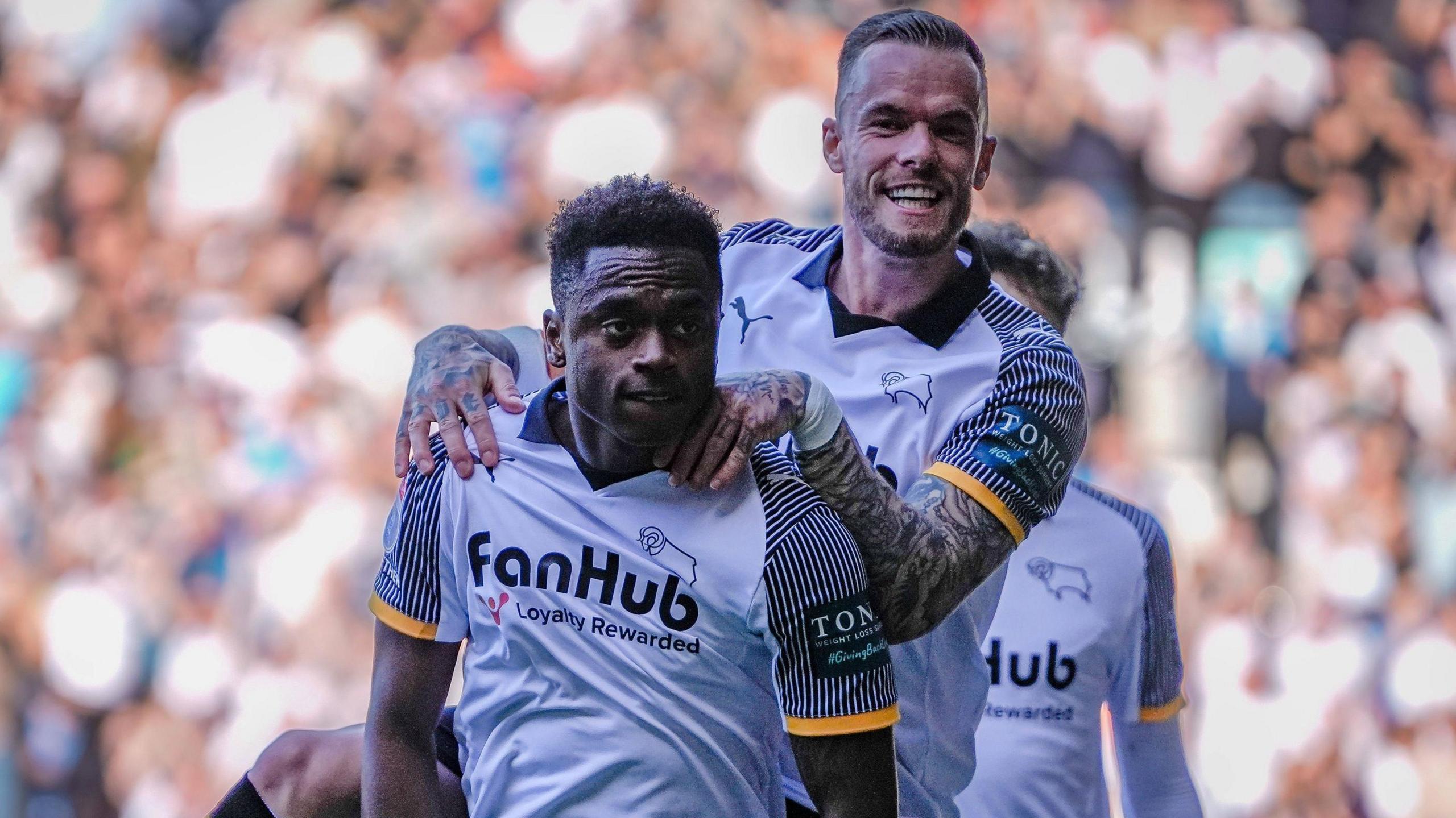 Jaydon Banel is jumped on by a team-mate as he celebrates scoring for Derby
